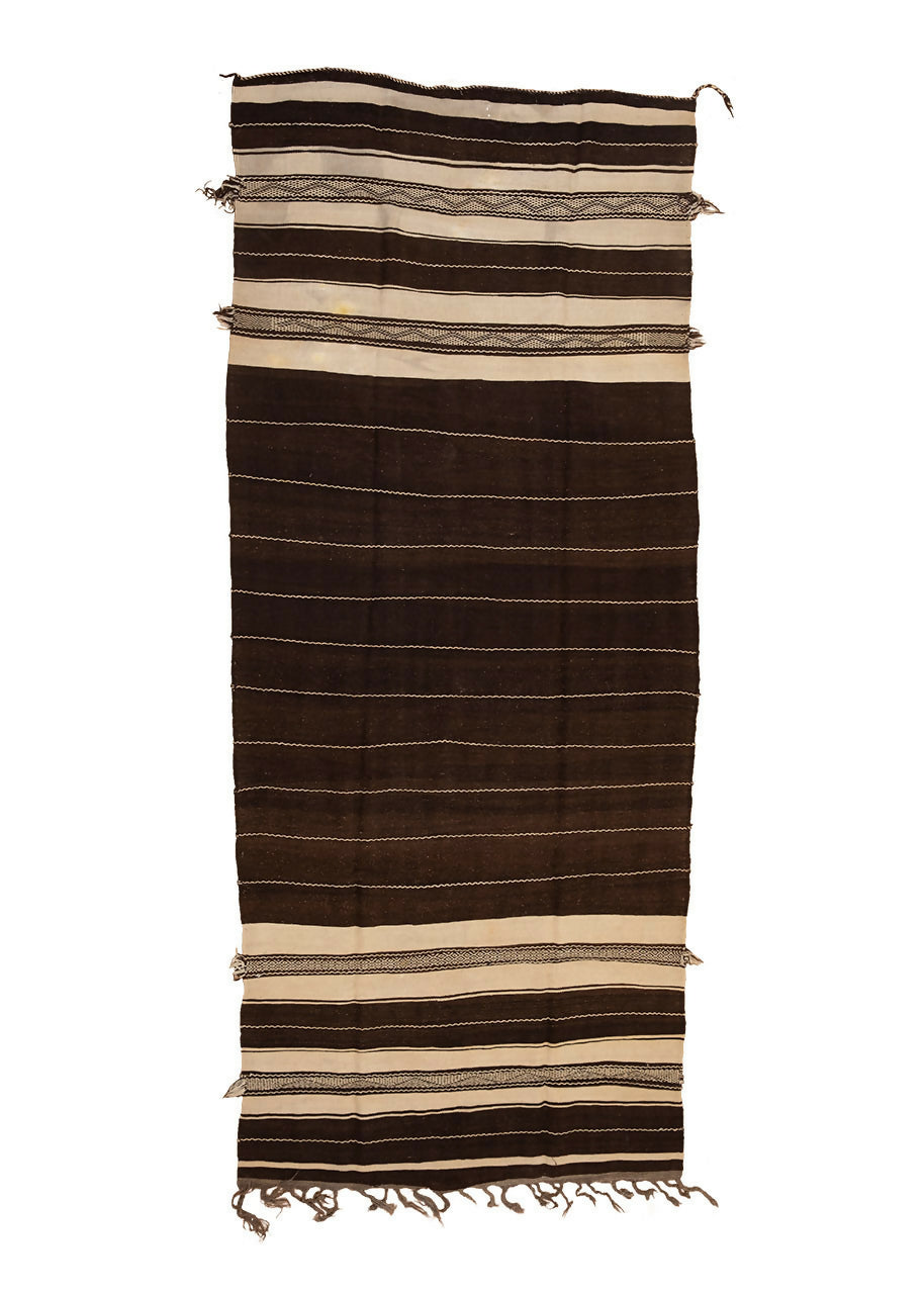 A traditional Moroccan Berber kilim rug with dark brown and cream stripes, featuring intricate embroidery,  available  to buy on the-salon.com. SALON curates the finest , unique, handmade pieces from the interior industry's best makers and brands. Shop luxury furniture, lighting, rugs, art, antiques and vintage pieces and accessories from SALON interior designed rooms.