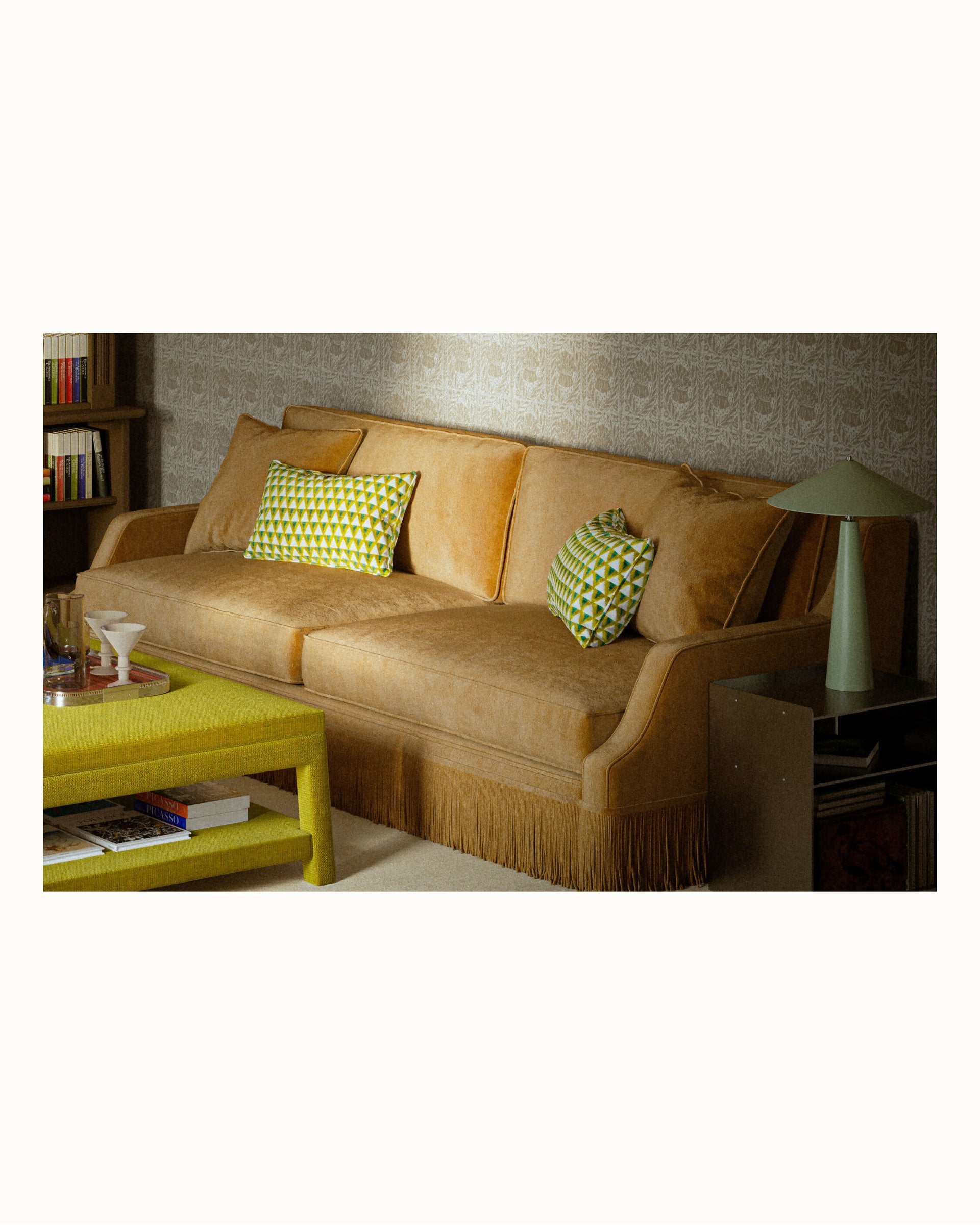 Brown sofa with green cushions in a living room setting,  available  to buy on the-salon.com. SALON curates the finest , unique, handmade pieces from the interior industry's best makers and brands. Shop luxury furniture, lighting, rugs, art, antiques and vintage pieces and accessories from SALON interior designed rooms.