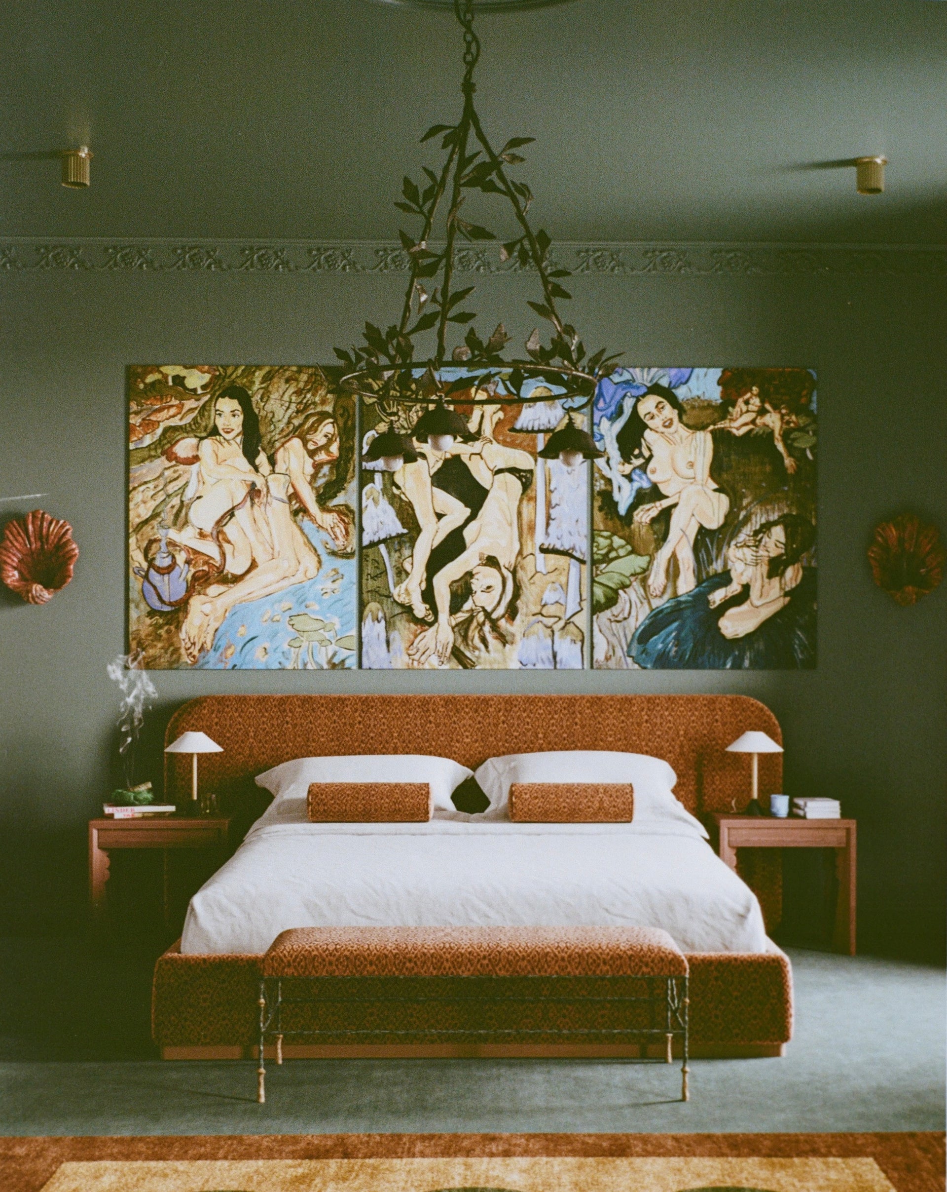 Bedroom with a large abstract painting above the bed