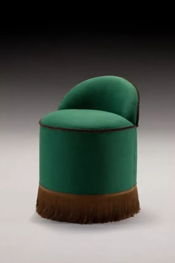 A close-up image of green repp fabric, displaying its texture and solid colour, displayed on an ottoman,  available  to buy on the-salon.com. SALON curates the finest , unique, handmade pieces from the interior industry's best makers and brands. Shop luxury furniture, lighting, rugs, art, antiques and vintage pieces and accessories from SALON interior designed rooms.