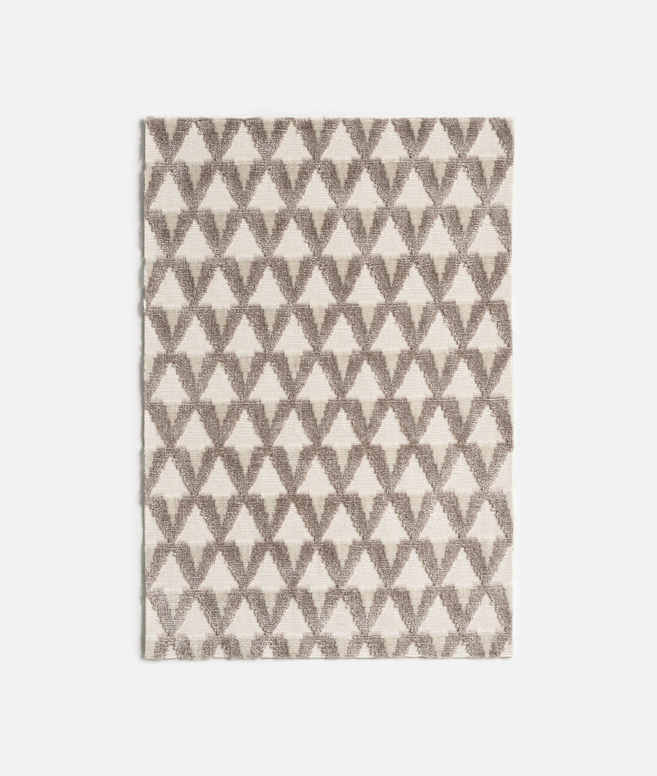 Grey and white geometric patterned fabric,available  to buy on the-salon.com. SALON curates the finest , unique, handmade pieces from the interior industry's best makers and brands. Shop luxury furniture, lighting, rugs, art, antiques and vintage pieces and accessories from SALON interior designed rooms