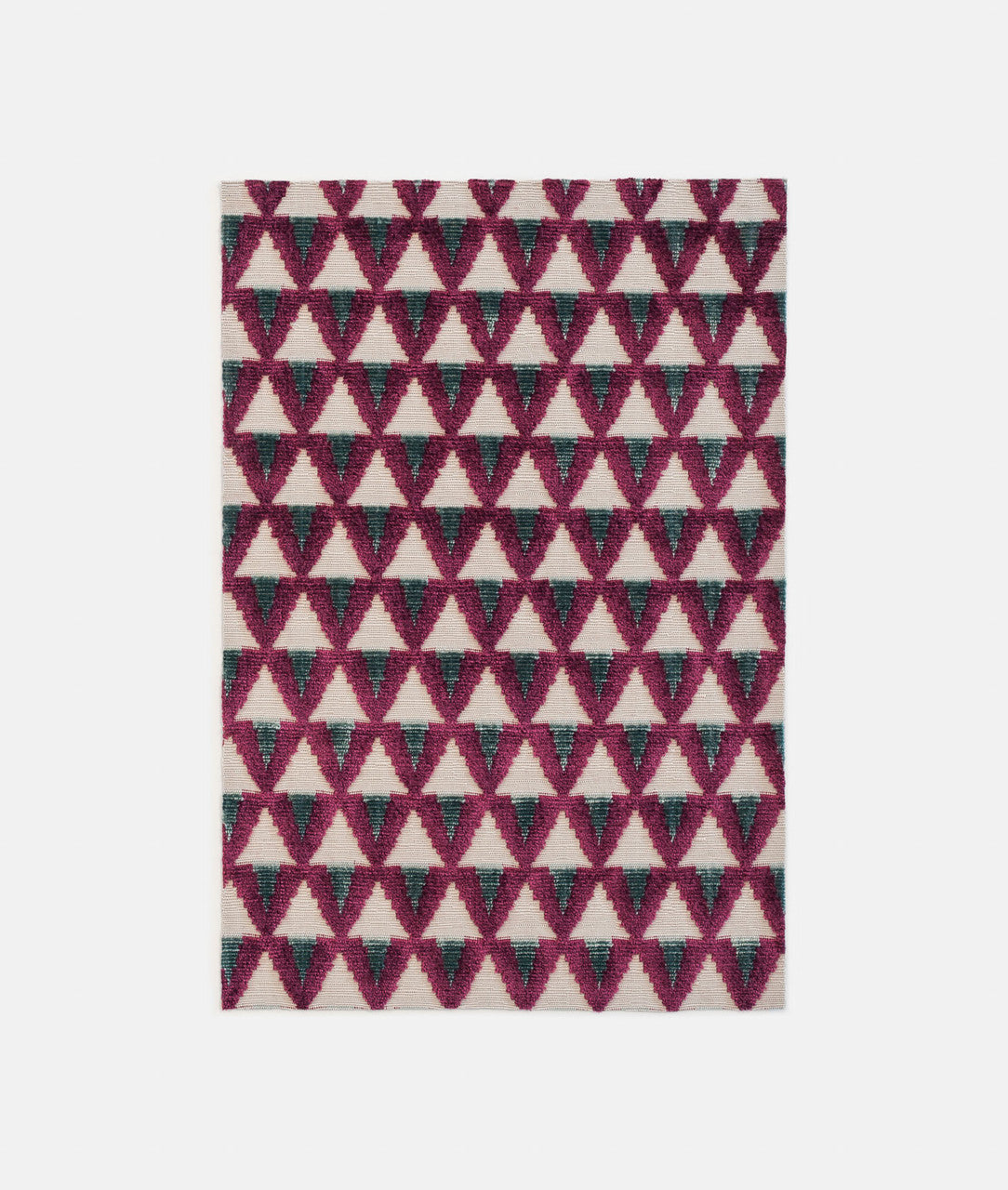 Rug with magenta and blue geometric triangle pattern on a plain backgroundavailable  to buy on the-salon.com. SALON curates the finest , unique, handmade pieces from the interior industry's best makers and brands. Shop luxury furniture, lighting, rugs, art, antiques and vintage pieces and accessories from SALON interior designed rooms