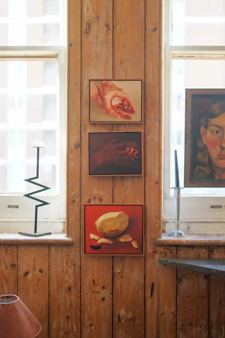 An oil painting by Sophie Glover featuring a peeled potato and slices on a red background, with a black element to the side,  available  to buy on the-salon.com. SALON curates the finest , unique, handmade pieces from the interior industry's best makers and brands. Shop luxury furniture, lighting, rugs, art, antiques and vintage pieces and accessories from SALON interior designed rooms.