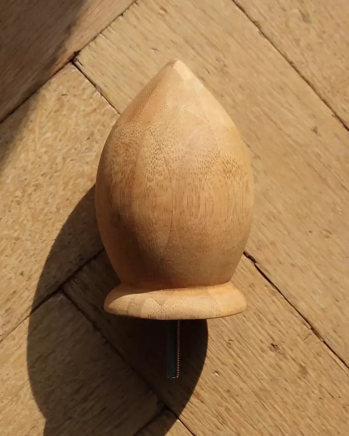 Wooden knob on a wooden surface