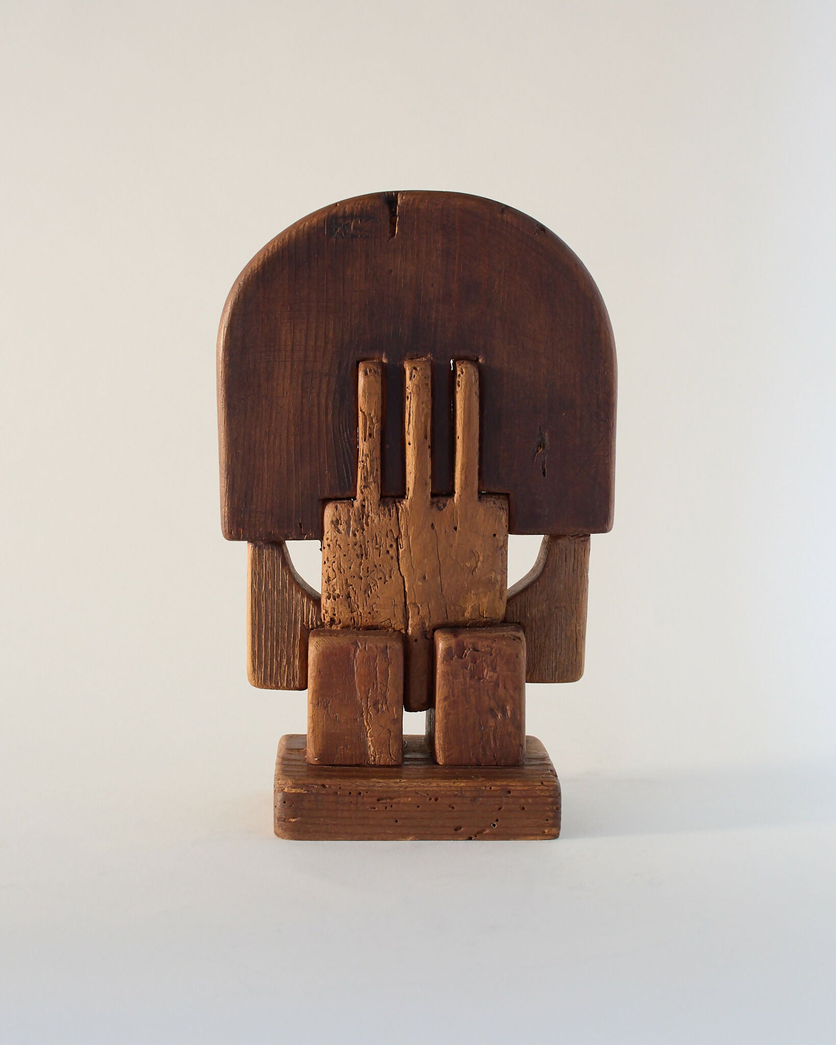 A hand-carved wooden sculpture by Adolf Vallazza, featuring an abstract figure with interlocking forms, with a dark brown to black color, available  to buy on the-salon.com. SALON curates the finest , unique, handmade pieces from the interior industry's best makers and brands. Shop luxury furniture, lighting, rugs, art, antiques and vintage pieces and accessories from SALON interior designed rooms.