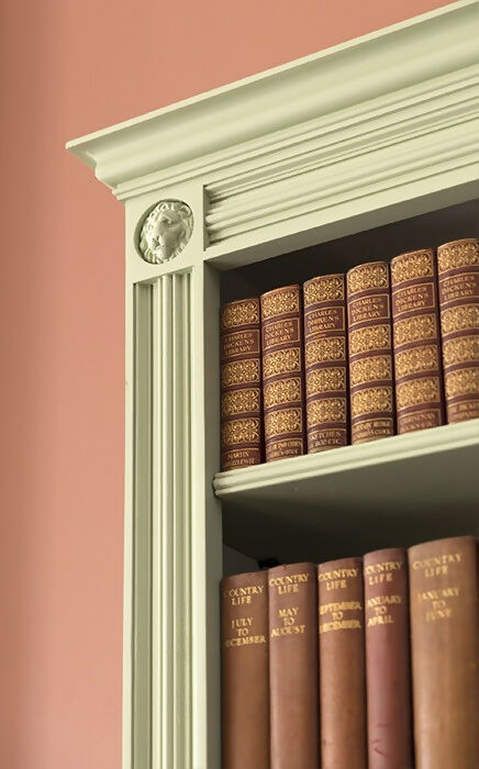 An image of a white bookcase with an ornate dwelling and a sculpture of a white lion on the corner,  available  to buy on the-salon.com. SALON curates the finest , unique, handmade pieces from the interior industry's best makers and brands. Shop luxury furniture, lighting, rugs, art, antiques and vintage pieces and accessories from SALON interior designed rooms.