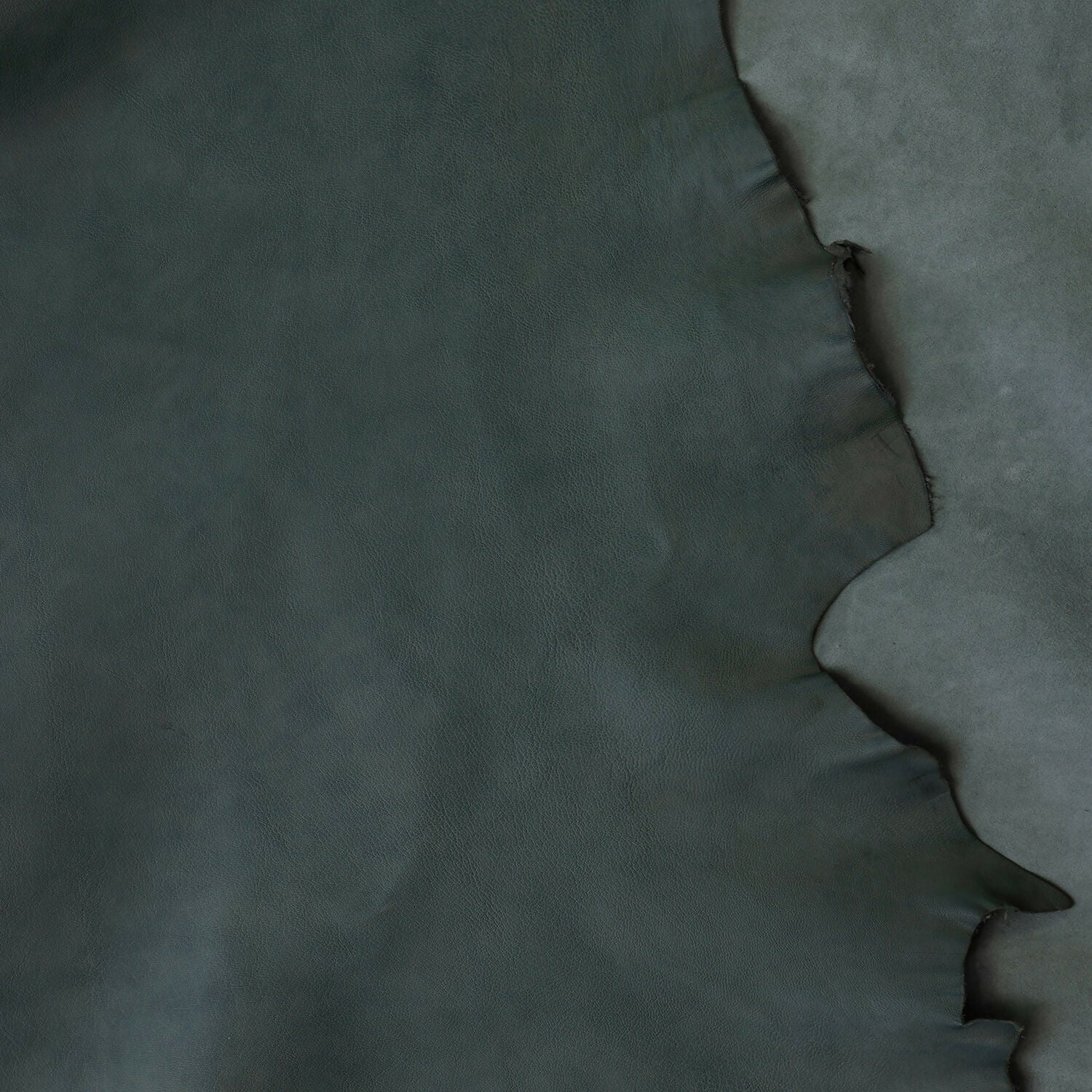 A close up on the leather feature of the brown wooden bedside table with a leather top,  available  to buy on the-salon.com. SALON curates the finest , unique, handmade pieces from the interior industry's best makers and brands. Shop luxury furniture, lighting, rugs, art, antiques and vintage pieces and accessories from SALON interior designed rooms.