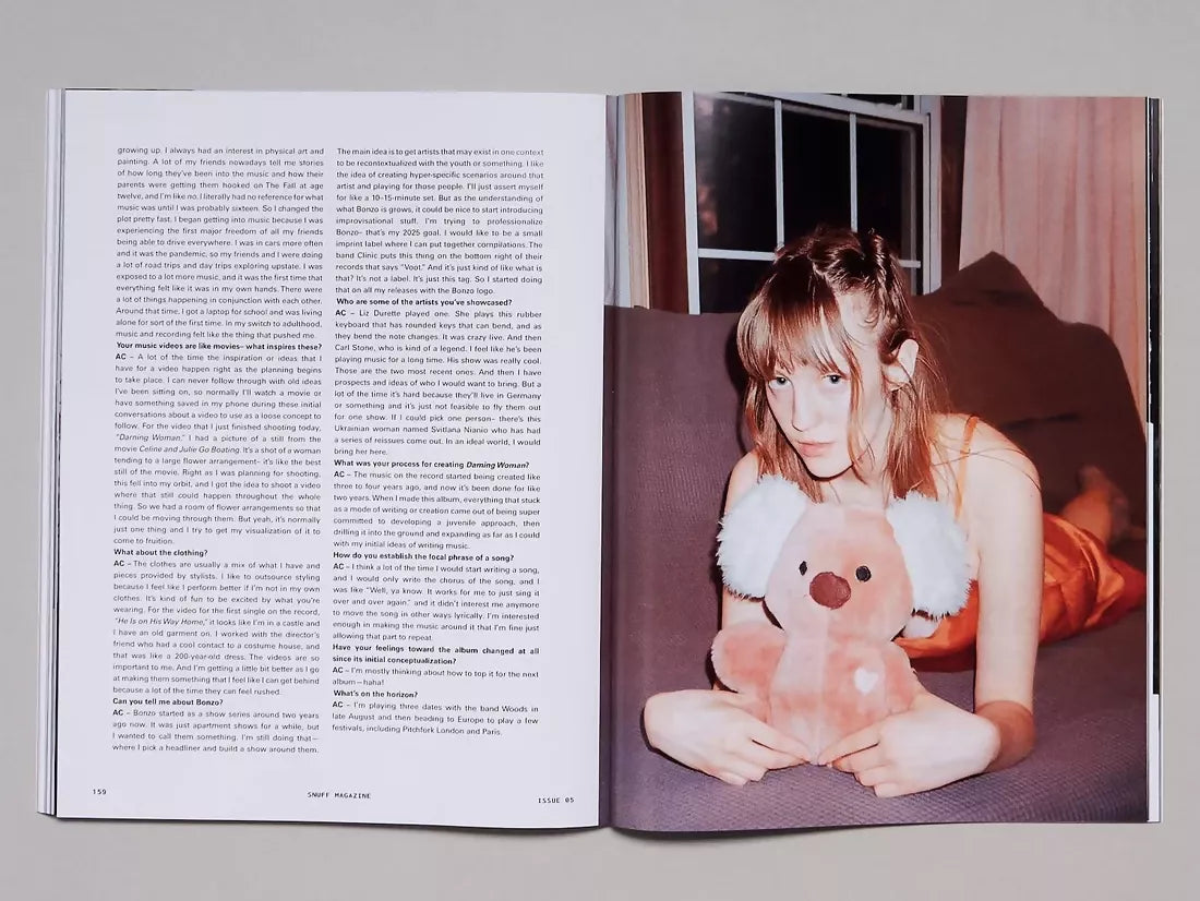 Open book, the page to one side a woman laying down holding a stuffed toy,  and the other side being a transcript of an interview,  available  to buy on the-salon.com. SALON curates the finest , unique, handmade pieces from the interior industry's best makers and brands. Shop luxury furniture, lighting, rugs, art, antiques and vintage pieces and accessories from SALON interior designed rooms.