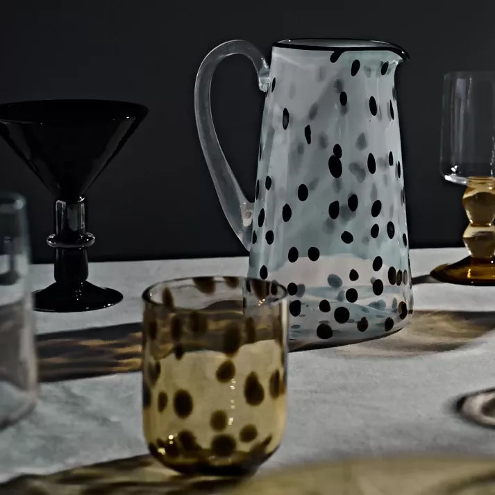 Polka dot pitcher and a whisky glass ,  available  to buy on the-salon.com. SALON curates the finest , unique, handmade pieces from the interior industry's best makers and brands. Shop luxury furniture, lighting, rugs, art, antiques and vintage pieces and accessories from SALON interior designed rooms.