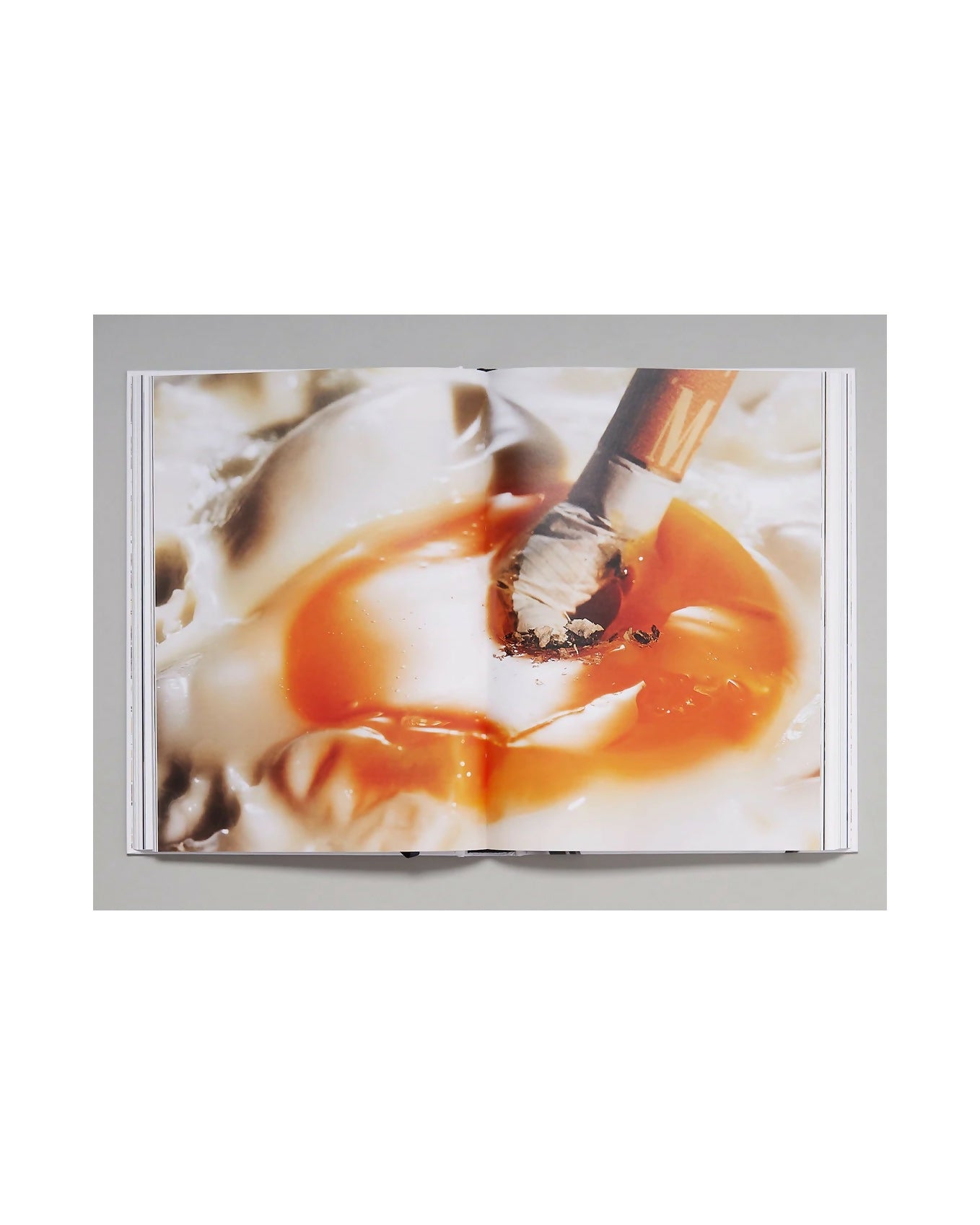 Close-up of a runny egg yolk  on a white background, available  to buy on the-salon.com. SALON curates the finest , unique, handmade pieces from the interior industry's best makers and brands. Shop luxury furniture, lighting, rugs, art, antiques and vintage pieces and accessories from SALON interior designed rooms.