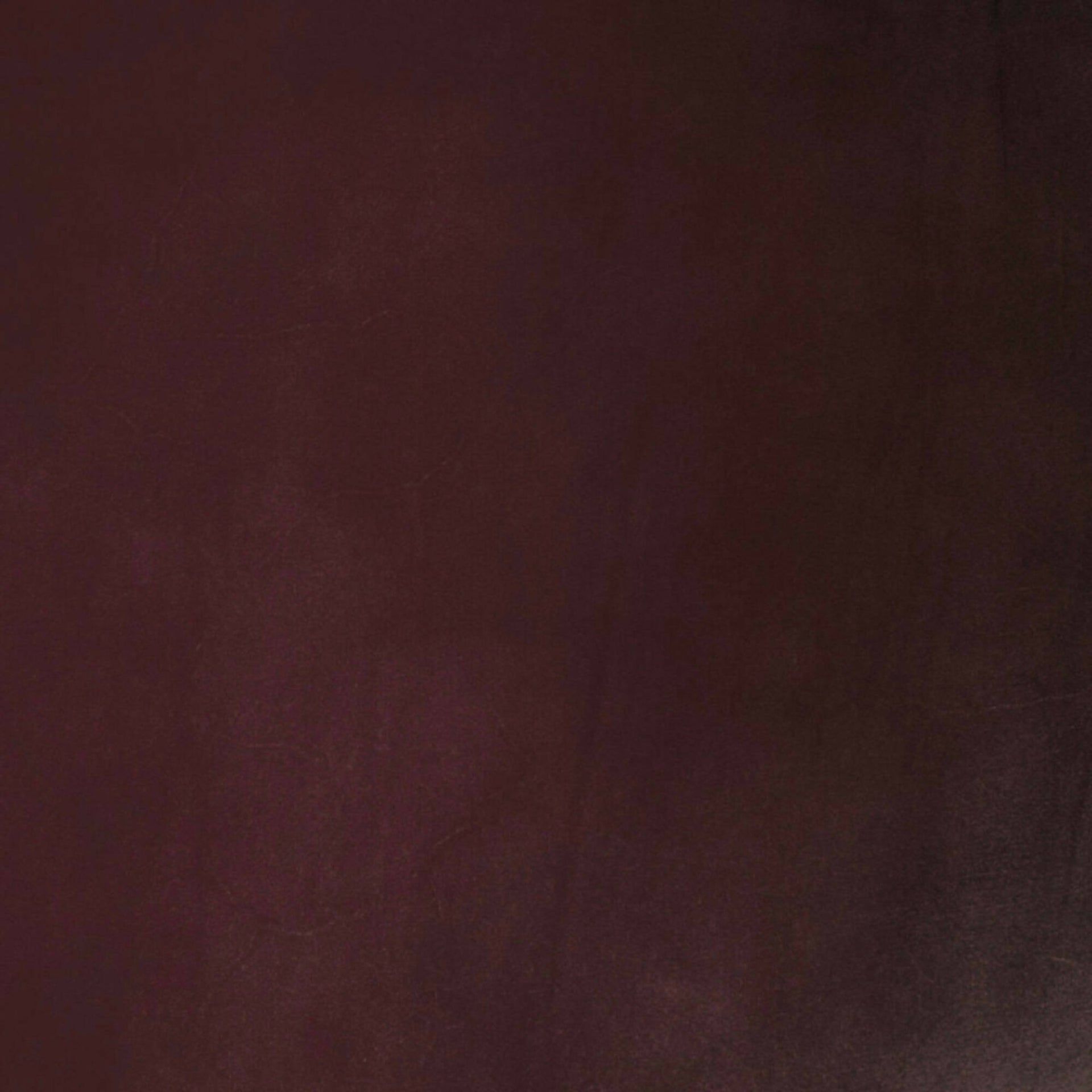 Close-up image of a burgundy leather flooring by Element7, available  to buy on the-salon.com. SALON curates the finest , unique, handmade pieces from the interior industry's best makers and brands. Shop luxury furniture, lighting, rugs, art, antiques and vintage pieces and accessories from SALON interior designed rooms.