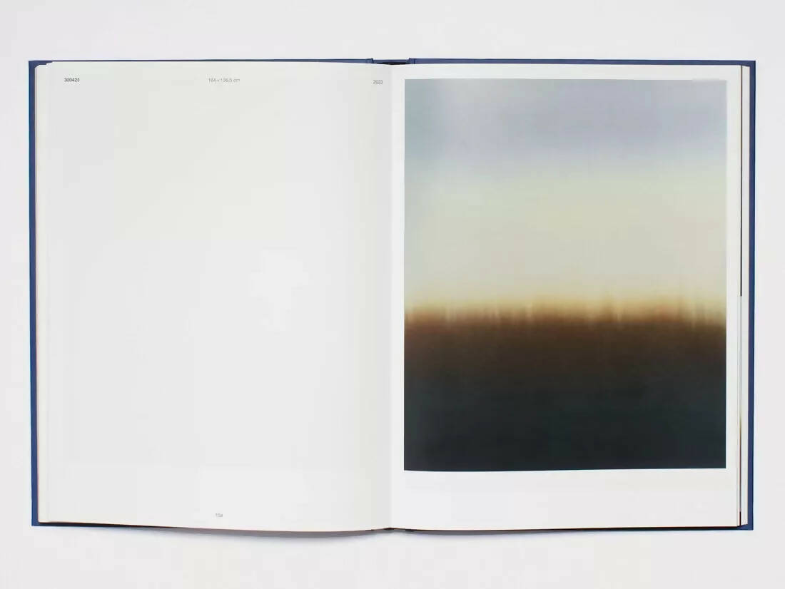 An image of an open book, on the pages there is one blank page and a picture of a gradient from light blue to a yellow dark tone,  available  to buy on the-salon.com. SALON curates the finest , unique, handmade pieces from the interior industry's best makers and brands. Shop luxury furniture, lighting, rugs, art, antiques and vintage pieces and accessories from SALON interior designed rooms.
