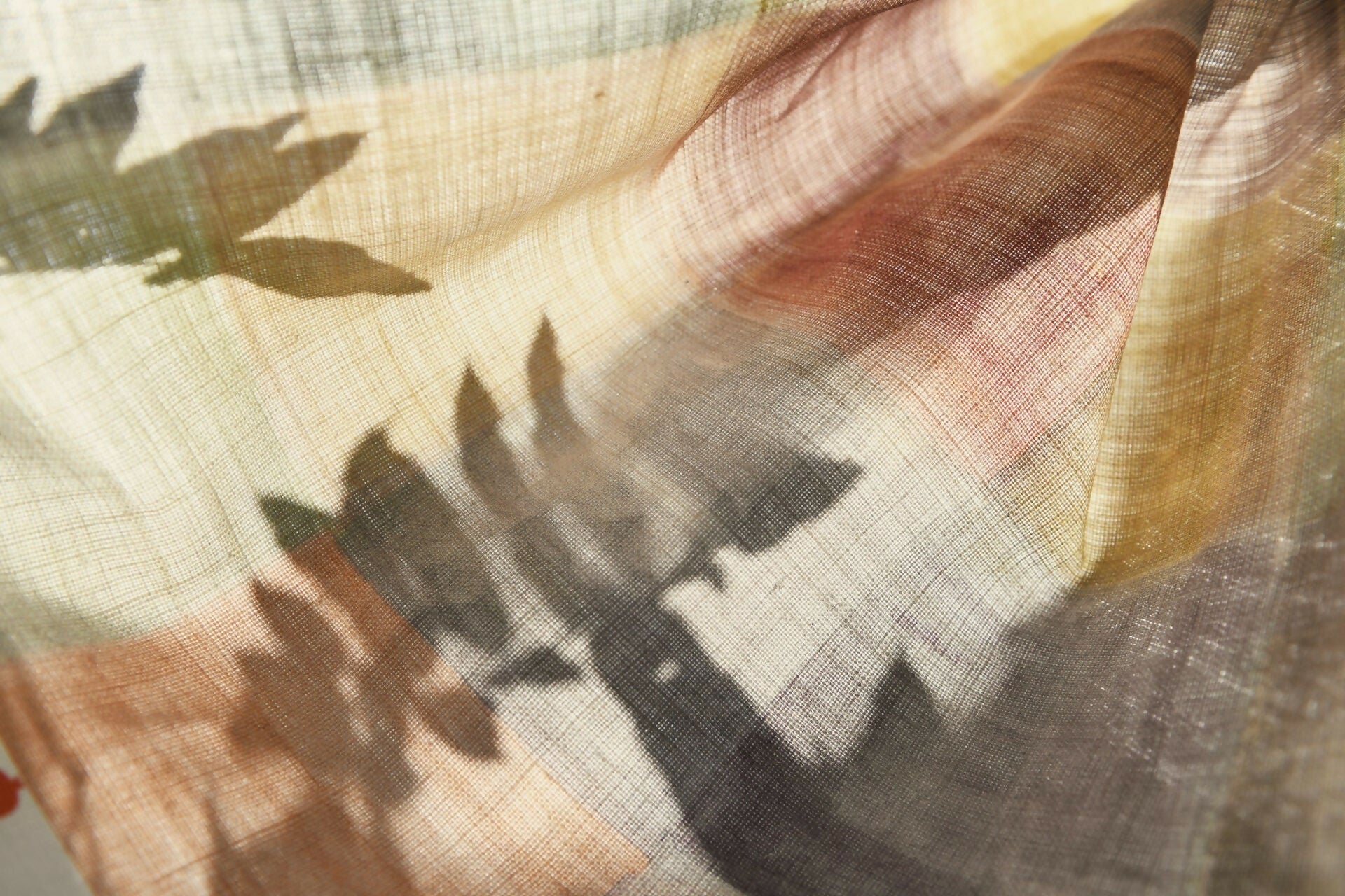 A close-up of a plaid fabric featuring a pattern of various solid colors, including blue, pink, green, and yellow,  available  to buy on the-salon.com. SALON curates the finest , unique, handmade pieces from the interior industry's best makers and brands. Shop luxury furniture, lighting, rugs, art, antiques and vintage pieces and accessories from SALON interior designed rooms.