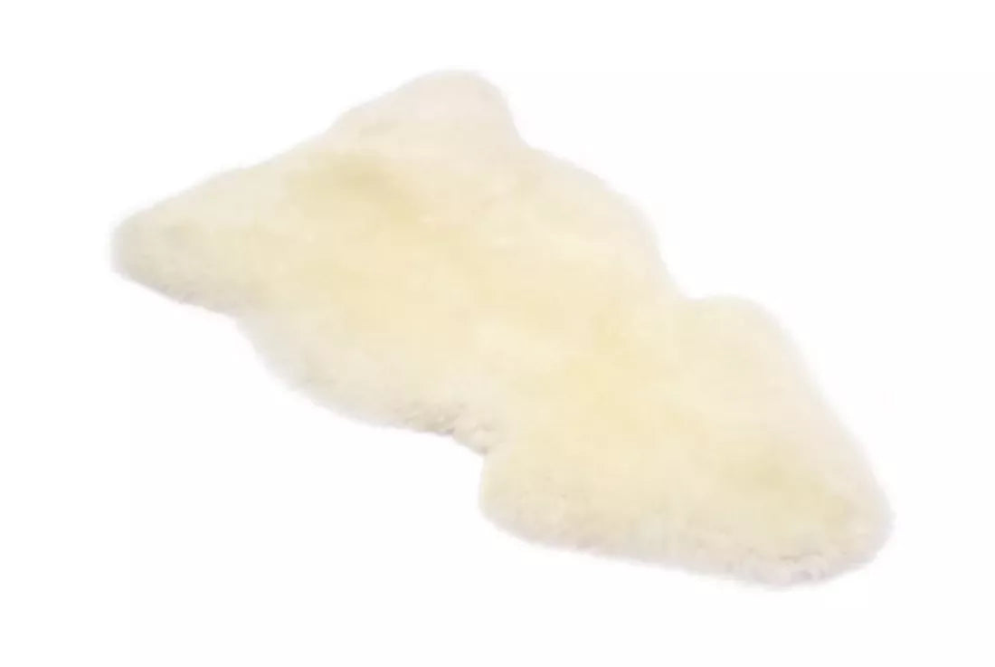 White sheepskin rug. The rug, available to buy from the-salon.com. SALON curates the finest unique handmade pieces from the interior industry's best makers and brands. Shop luxury furniture, lighting, rugs, art, antiques and vintage pieces and accessories from SALON interior designed rooms. 