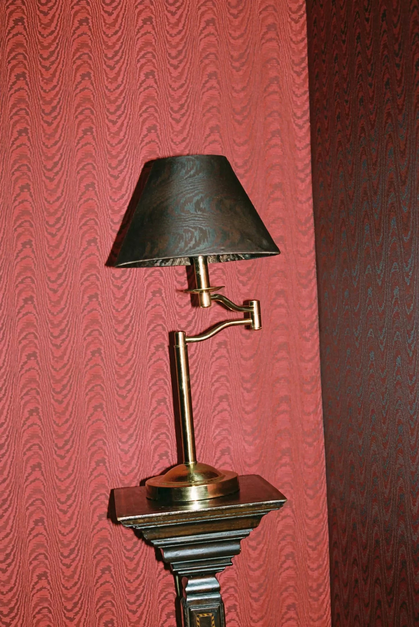 Close-up view of a brown moiré patterned fabric on a lampshade,  available  to buy on the-salon.com. SALON curates the finest , unique, handmade pieces from the interior industry's best makers and brands. Shop luxury furniture, lighting, rugs, art, antiques and vintage pieces and accessories from SALON interior designed rooms.