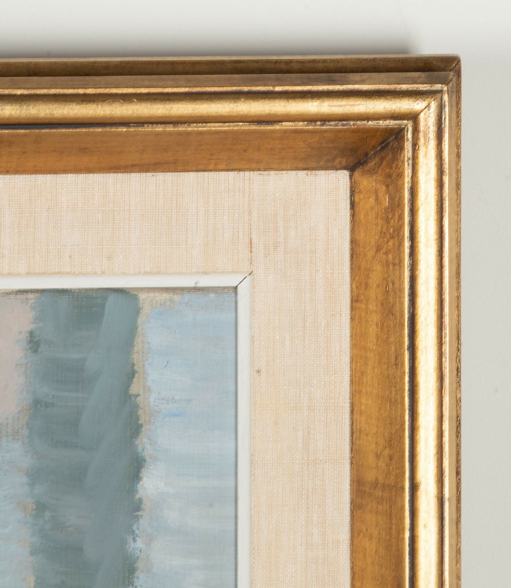 Close-up of a gold picture frame with a painting inside on a light gray background,  available  to buy on the-salon.com. SALON curates the finest , unique, handmade pieces from the interior industry's best makers and brands. Shop luxury furniture, lighting, rugs, art, antiques and vintage pieces and accessories from SALON interior designed rooms.