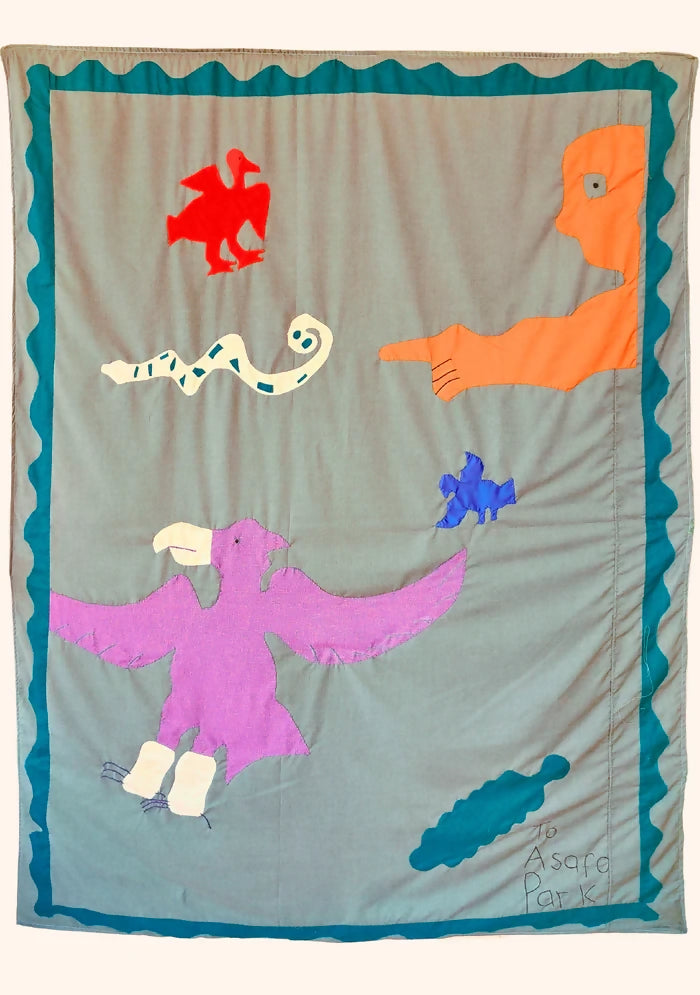 A colorful textile wall hanging featuring various whimsical characters, including a snake, a falcon, an eagle, and a turquoise bird, with a man in the corner,  available  to buy on the-salon.com. SALON curates the finest , unique, handmade pieces from the interior industry's best makers and brands. Shop luxury furniture, lighting, rugs, art, antiques and vintage pieces and accessories from SALON interior designed rooms.