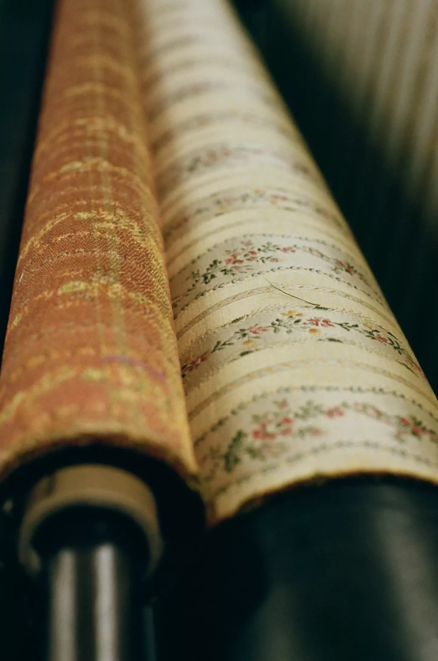 Close-up of Spitalfields stripe straw fabric with a jacquard weave, featuring floral motifs and silk leaves, in a warm honey tone,  available  to buy on the-salon.com. SALON curates the finest , unique, handmade pieces from the interior industry's best makers and brands. Shop luxury furniture, lighting, rugs, art, antiques and vintage pieces and accessories from SALON interior designed rooms.