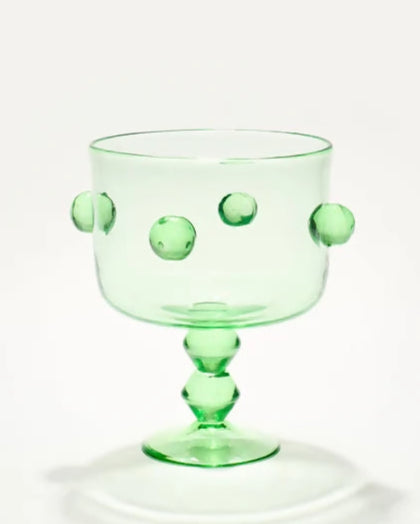 Green glass trifle vase  on a white background, available  to buy on the-salon.com. SALON curates the finest , unique, handmade pieces from the interior industry's best makers and brands. Shop luxury furniture, lighting, rugs, art, antiques and vintage pieces and accessories from SALON interior designed rooms.