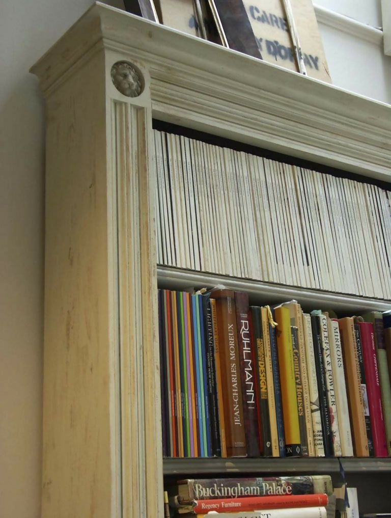 An image of a white bookcase, filled with vintage books,  available  to buy on the-salon.com. SALON curates the finest , unique, handmade pieces from the interior industry's best makers and brands. Shop luxury furniture, lighting, rugs, art, antiques and vintage pieces and accessories from SALON interior designed rooms.