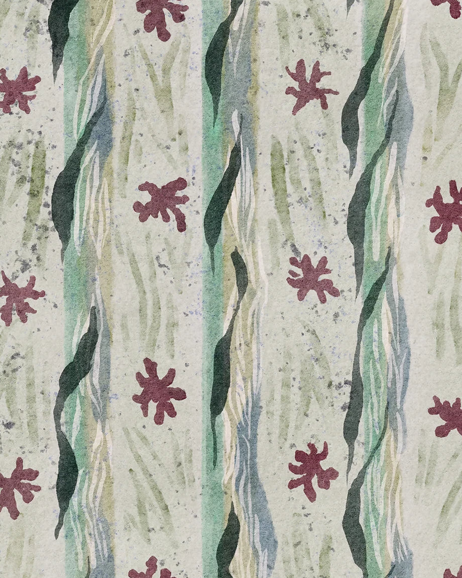 Textile sample with wavy pattern and red floral-like shapes on a neutral background