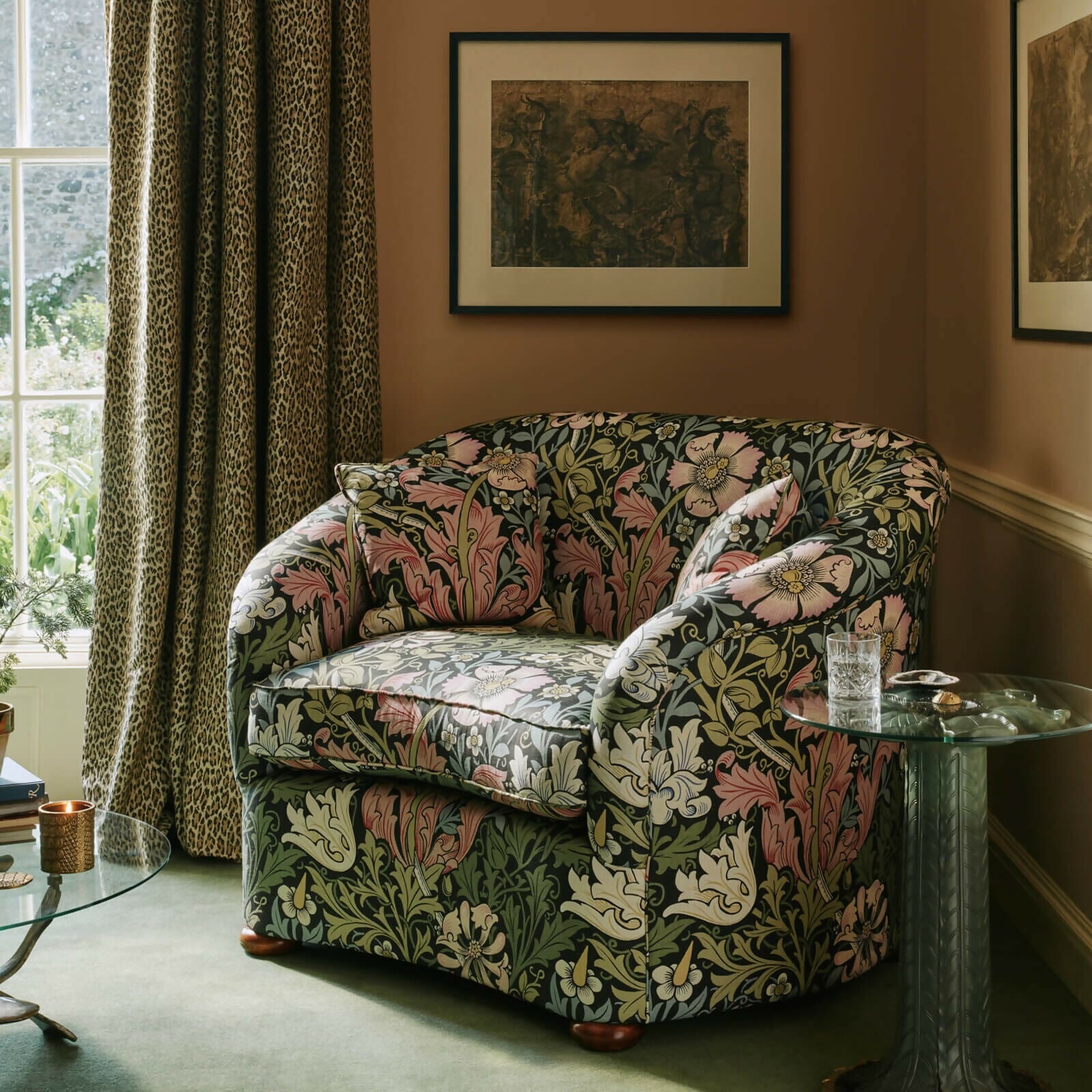 Living room with patterned walls, a purple sofa, and a brown armchair,  available  to buy on the-salon.com. SALON curates the finest , unique, handmade pieces from the interior industry's best makers and brands. Shop luxury furniture, lighting, rugs, art, antiques and vintage pieces and accessories from SALON interior designed rooms.