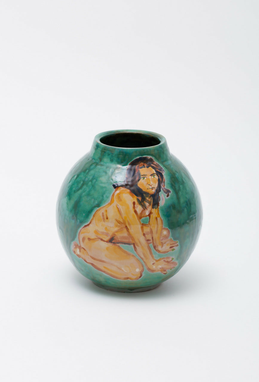 Green ceramic vase with a figurative design on a white background,  available  to buy on the-salon.com. SALON curates the finest , unique, handmade pieces from the interior industry's best makers and brands. Shop luxury furniture, lighting, rugs, art, antiques and vintage pieces and accessories from SALON interior designed rooms.