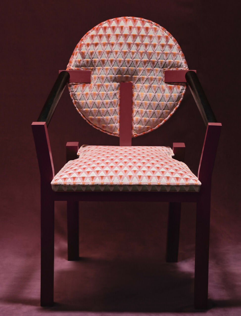 Chair with patterned fabric on a dark background,available  to buy on the-salon.com. SALON curates the finest , unique, handmade pieces from the interior industry's best makers and brands. Shop luxury furniture, lighting, rugs, art, antiques and vintage pieces and accessories from SALON interior designed rooms