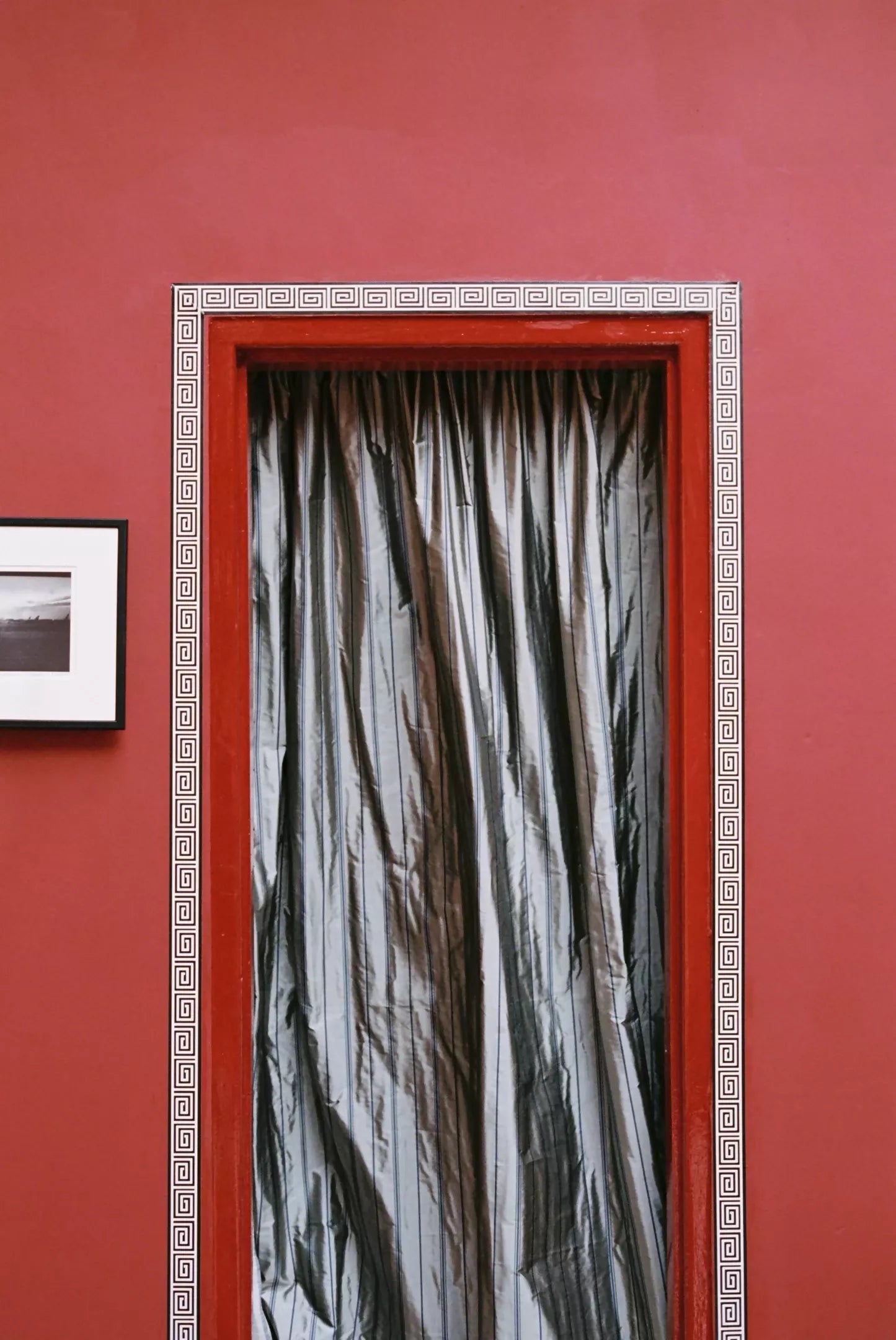 A view of tafta stripe fabric in grey showcasing its navy blue stripes, texture and reflective quality on curtain,  available  to buy on the-salon.com. SALON curates the finest , unique, handmade pieces from the interior industry's best makers and brands. Shop luxury furniture, lighting, rugs, art, antiques and vintage pieces and accessories from SALON interior designed rooms.