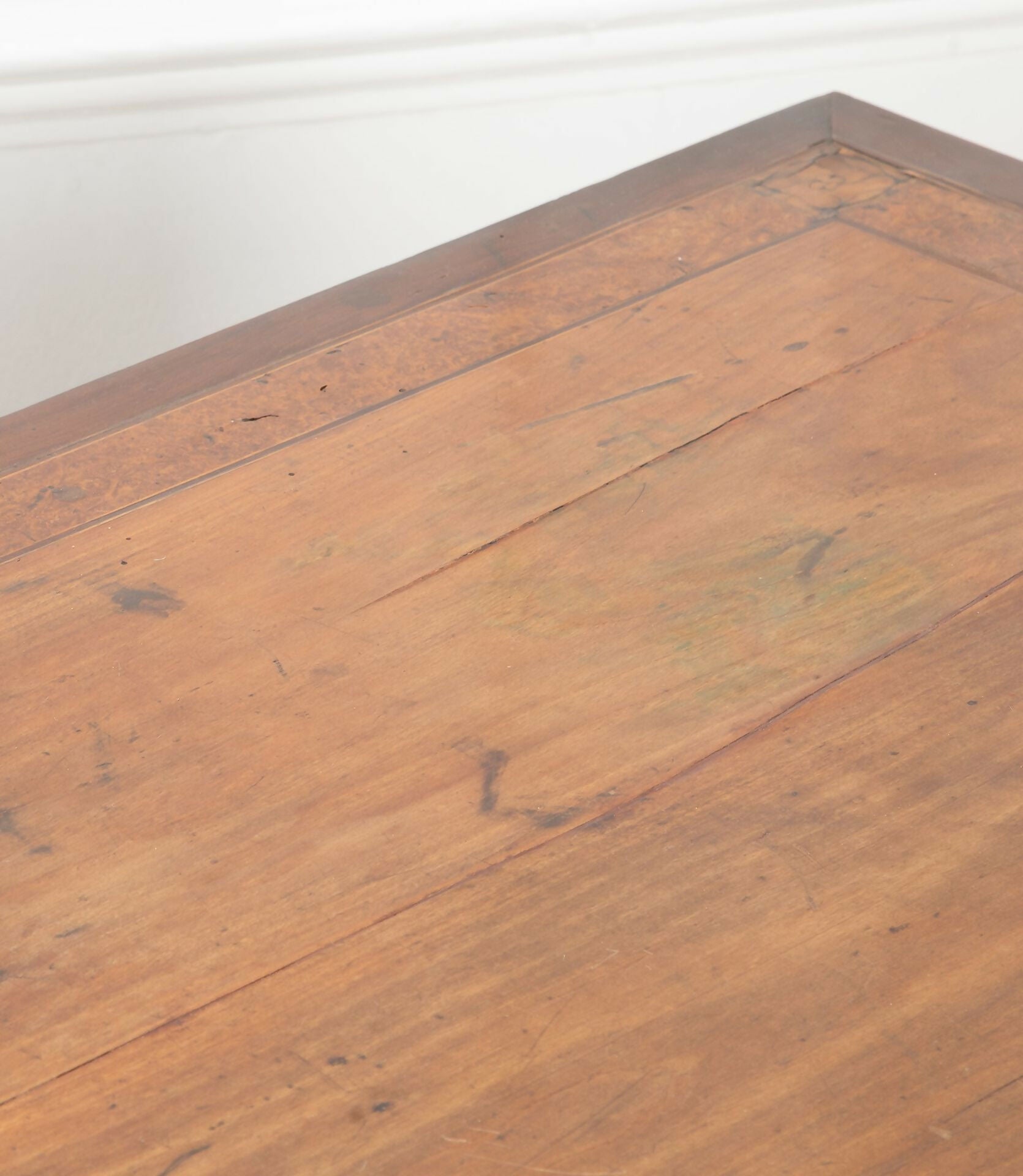 Close-up of a wooden floor with visible grain and texture,  available  to buy on the-salon.com. SALON curates the finest , unique, handmade pieces from the interior industry's best makers and brands. Shop luxury furniture, lighting, rugs, art, antiques and vintage pieces and accessories from SALON interior designed rooms.