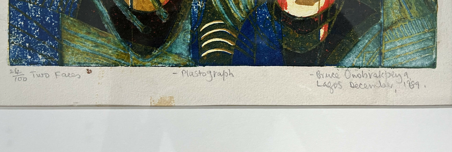 Artistic depiction of two faces with a signature at the bottom