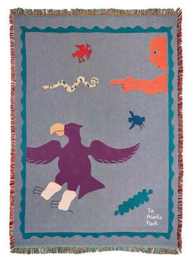 A colorful handcrafted blanket with animal and imaginative figures displayed on a wall, titled 'To ASAFO PARK THROW BLANKET BY AMECHI',  available  to buy on the-salon.com. SALON curates the finest , unique, handmade pieces from the interior industry's best makers and brands. Shop luxury furniture, lighting, rugs, art, antiques and vintage pieces and accessories from SALON interior designed rooms.