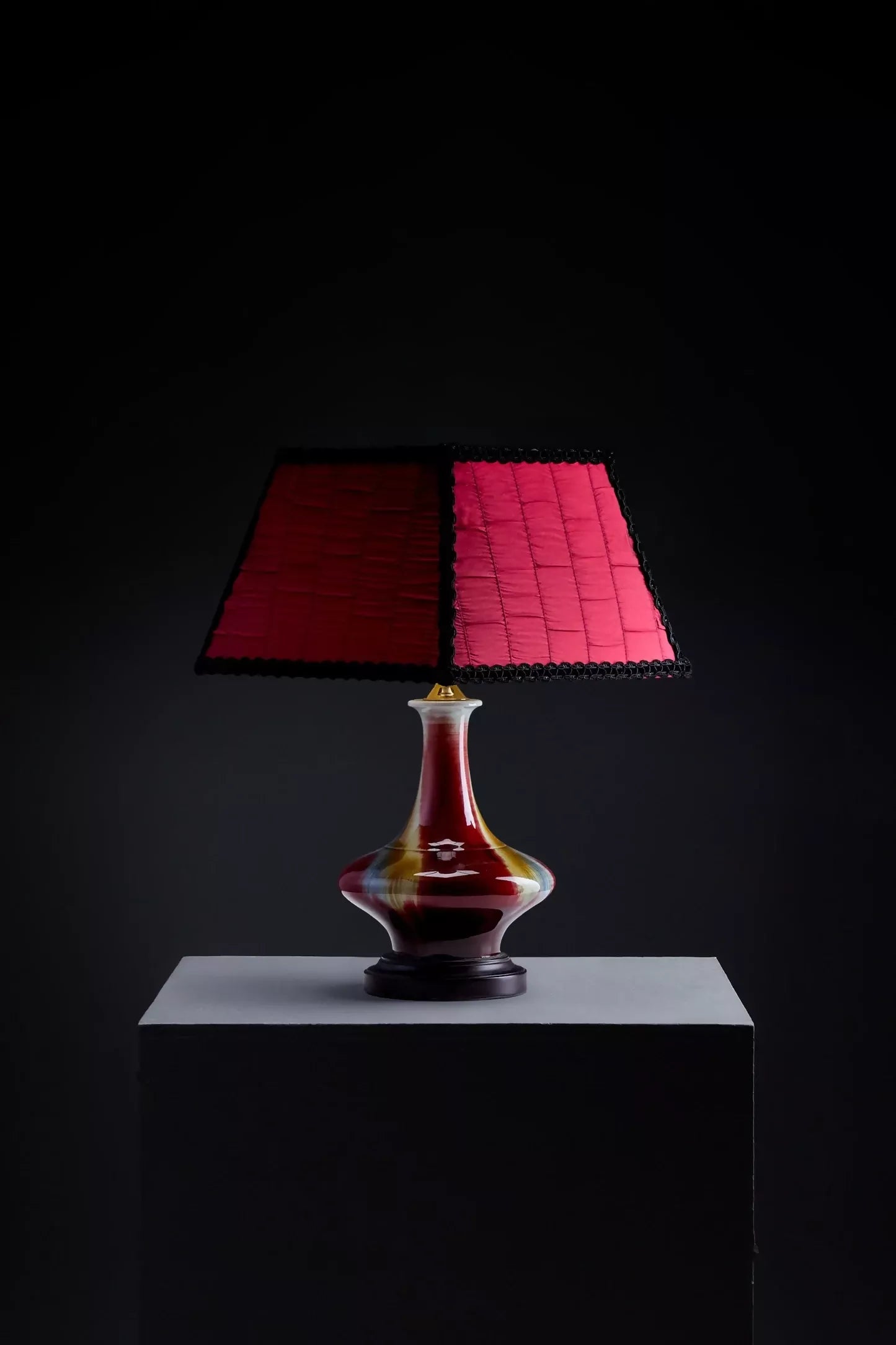 Close-up of a red textured fabric with subtle rouches , as a lampshade, woven in the UK,  available  to buy on the-salon.com. SALON curates the finest , unique, handmade pieces from the interior industry's best makers and brands. Shop luxury furniture, lighting, rugs, art, antiques and vintage pieces and accessories from SALON interior designed rooms.