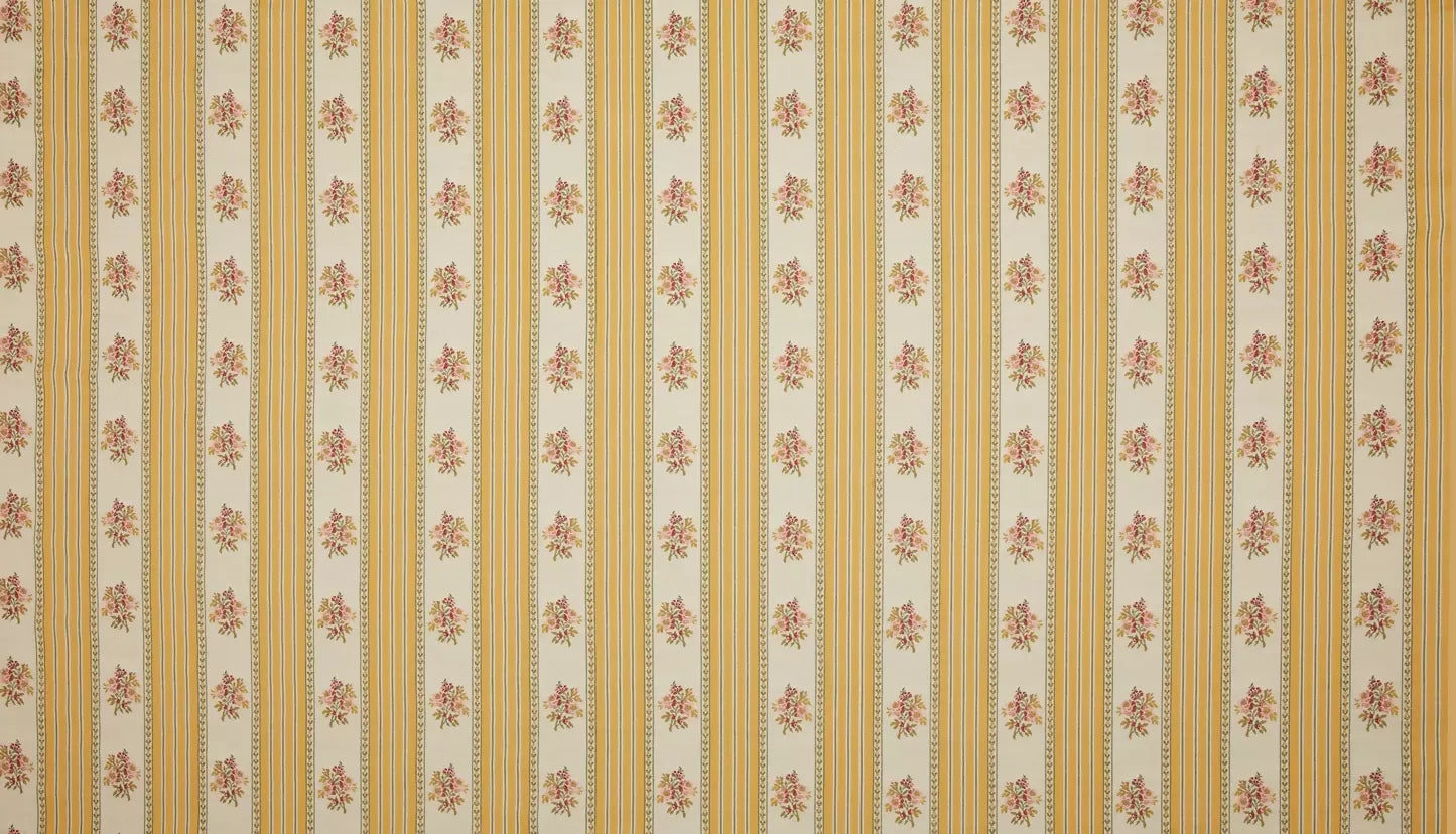 Close-up view of a jacquard weave fabric featuring a sofa stripe pattern with yellow and green stripes and embroidered floral motifs,  available  to buy on the-salon.com. SALON curates the finest , unique, handmade pieces from the interior industry's best makers and brands. Shop luxury furniture, lighting, rugs, art, antiques and vintage pieces and accessories from SALON interior designed rooms.