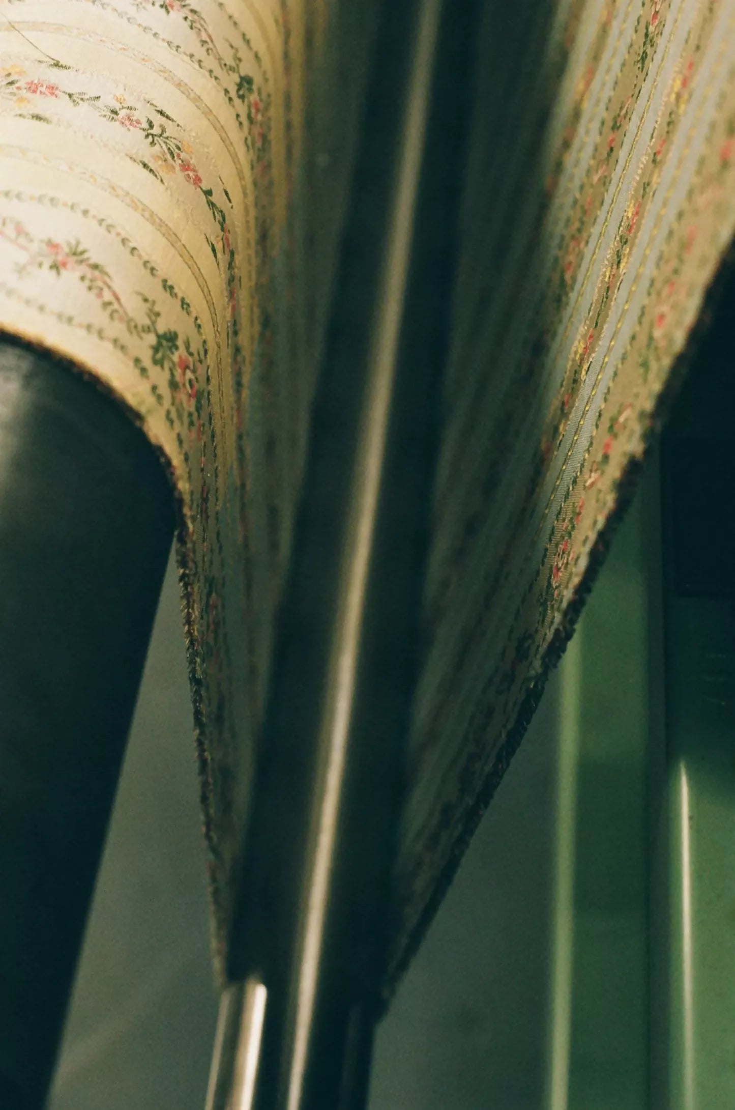 Close-up of Spitalfields stripe straw fabric with a jacquard weave, featuring floral motifs and silk leaves, in a warm honey tone,  available  to buy on the-salon.com. SALON curates the finest , unique, handmade pieces from the interior industry's best makers and brands. Shop luxury furniture, lighting, rugs, art, antiques and vintage pieces and accessories from SALON interior designed rooms.