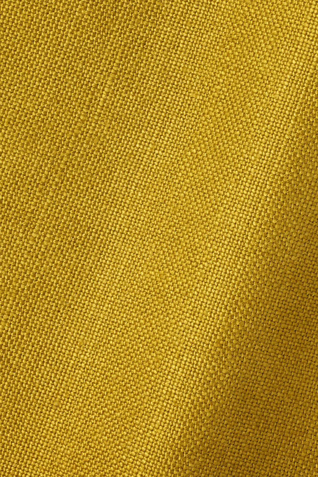 A close up of the upholstered fabric used for the arm chair,  available  to buy on the-salon.com. SALON curates the finest , unique, handmade pieces from the interior industry's best makers and brands. Shop luxury furniture, lighting, rugs, art, antiques and vintage pieces and accessories from SALON interior designed rooms.
