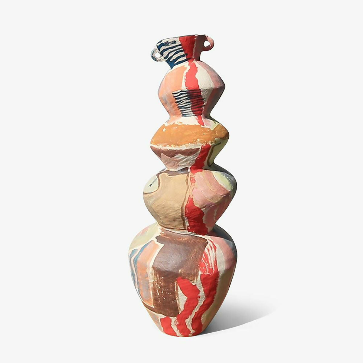 Colourful ceramic vase with abstract patterns on a white background, available  to buy on the-salon.com. SALON curates the finest , unique, handmade pieces from the interior industry's best makers and brands. Shop luxury furniture, lighting, rugs, art, antiques and vintage pieces and accessories from SALON interior designed rooms.