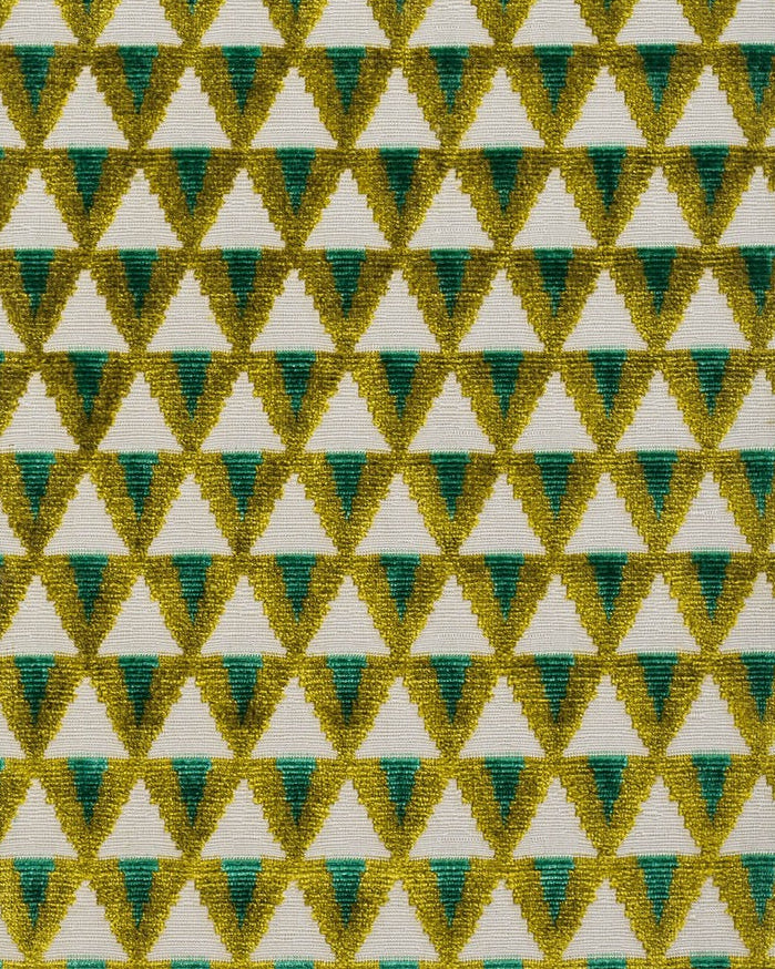 A geometric patterned fabric in green and yellow tones on a white background, likely used for upholstery,available  to buy on the-salon.com. SALON curates the finest , unique, handmade pieces from the interior industry's best makers and brands. Shop luxury furniture, lighting, rugs, art, antiques and vintage pieces and accessories from SALON interior designed rooms