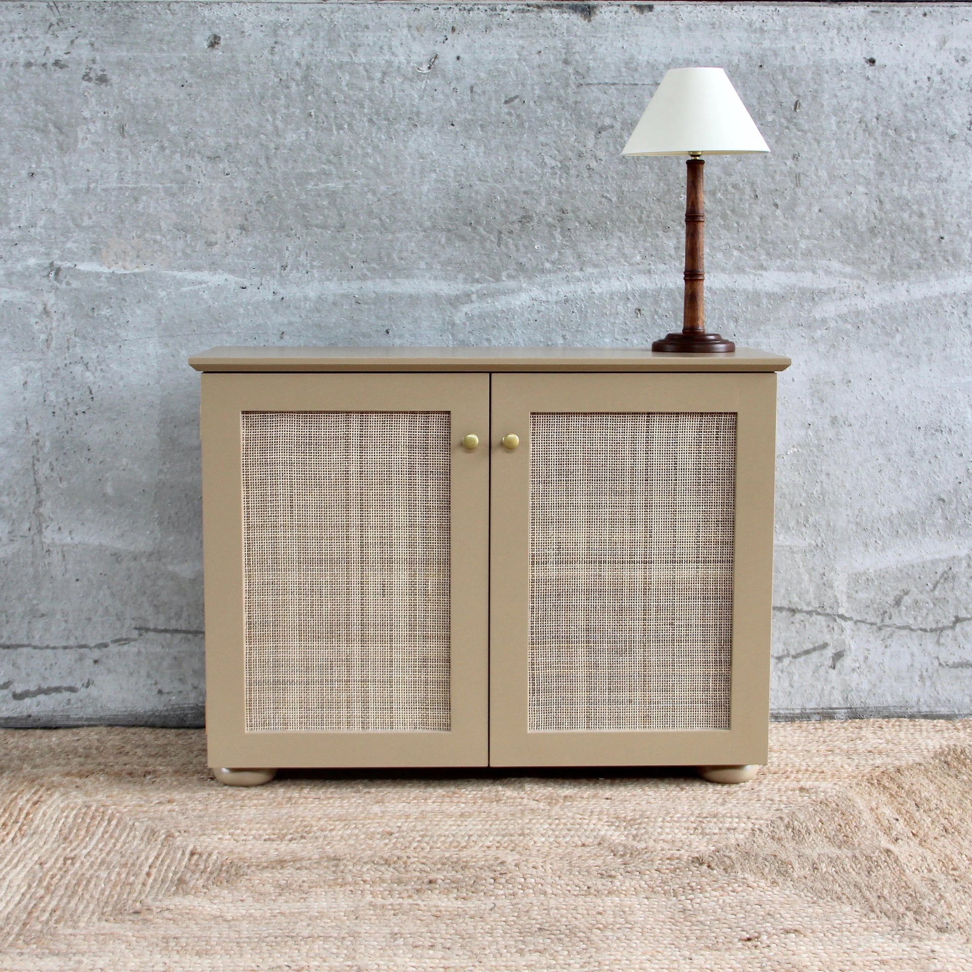 CANED CABINET BY ALFRED NEWALL