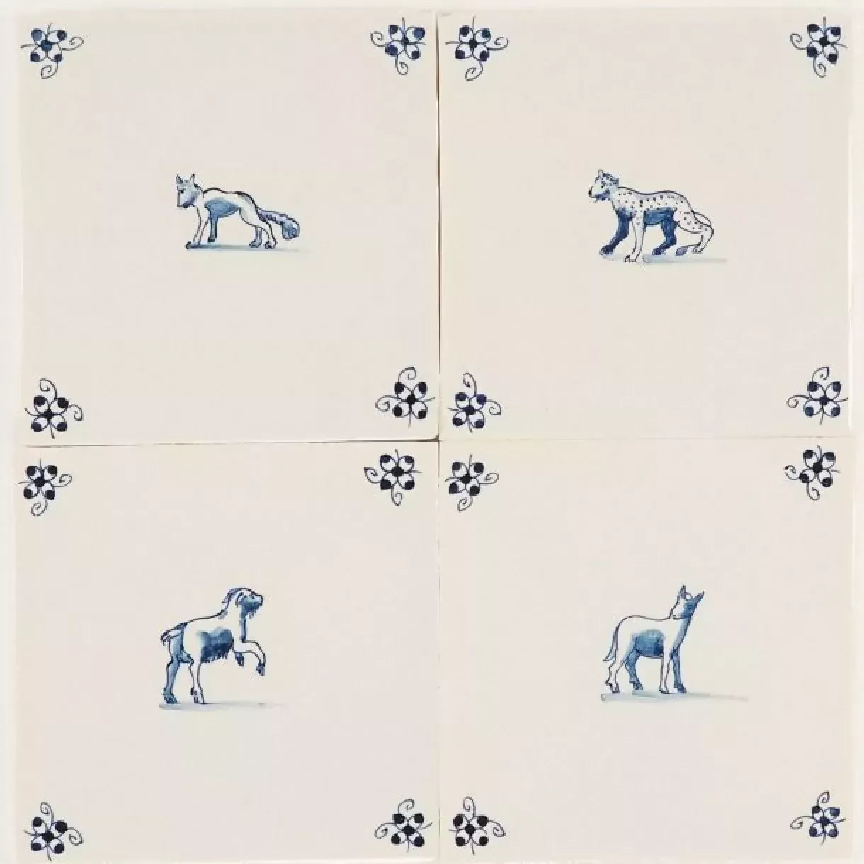 Set of ceramic tiles with blue animal and floral designs on a beige background,  available  to buy on the-salon.com. SALON curates the finest , unique, handmade pieces from the interior industry's best makers and brands. Shop luxury furniture, lighting, rugs, art, antiques and vintage pieces and accessories from SALON interior designed rooms.