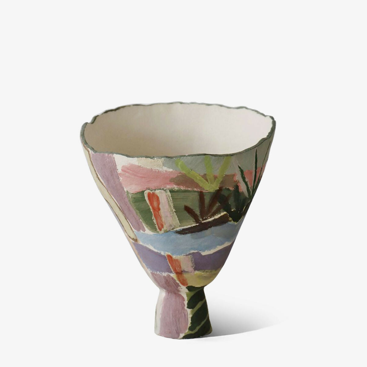 Decorative ceramic bowl with colorful abstract pattern on a white background,  available  to buy on the-salon.com. SALON curates the finest , unique, handmade pieces from the interior industry's best makers and brands. Shop luxury furniture, lighting, rugs, art, antiques and vintage pieces and accessories from SALON interior designed rooms.