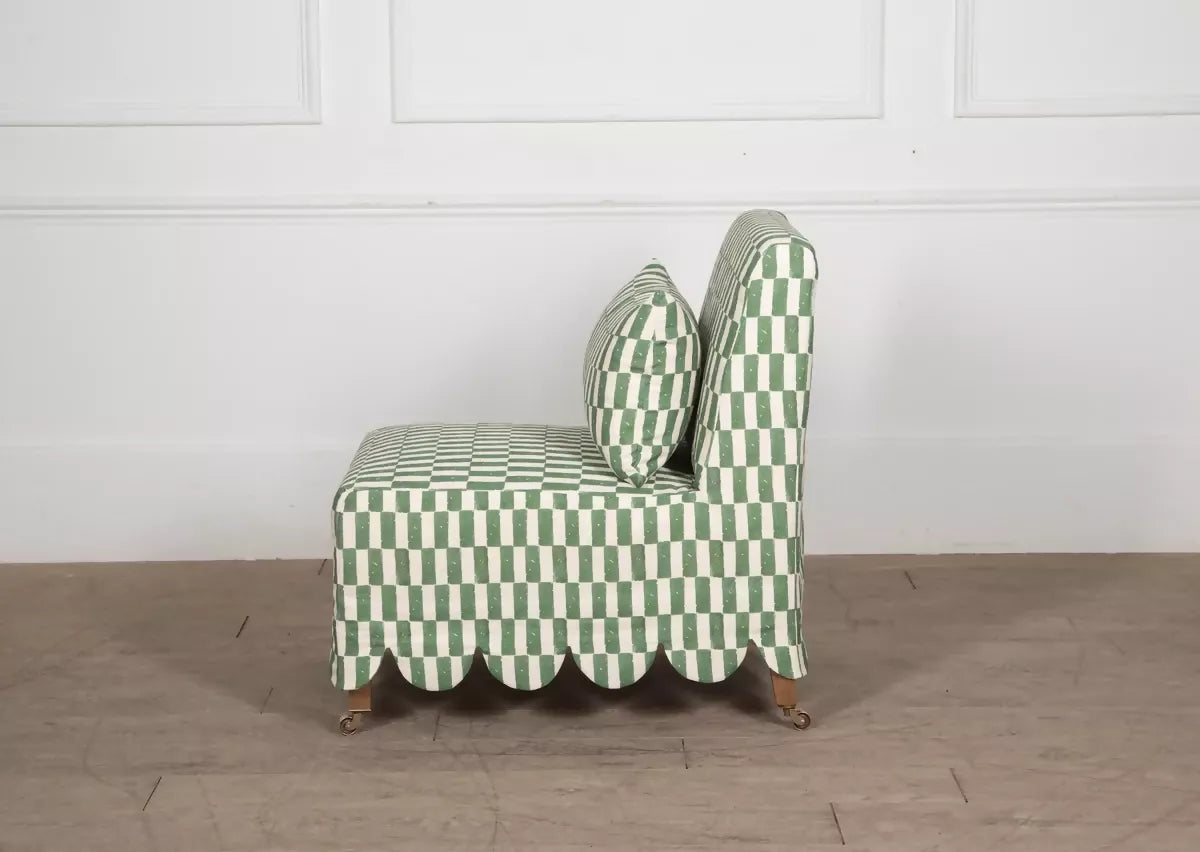Green and white checkered chair on a wooden floor with a white wall background,  available  to buy on the-salon.com. SALON curates the finest , unique, handmade pieces from the interior industry's best makers and brands. Shop luxury furniture, lighting, rugs, art, antiques and vintage pieces and accessories from SALON interior designed rooms.