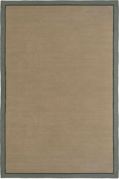 Close-up view of a hand woven dhurrie rug with a plain design and a visible border,  available  to buy on the-salon.com. SALON curates the finest , unique, handmade pieces from the interior industry's best makers and brands. Shop luxury furniture, lighting, rugs, art, antiques and vintage pieces and accessories from SALON interior d