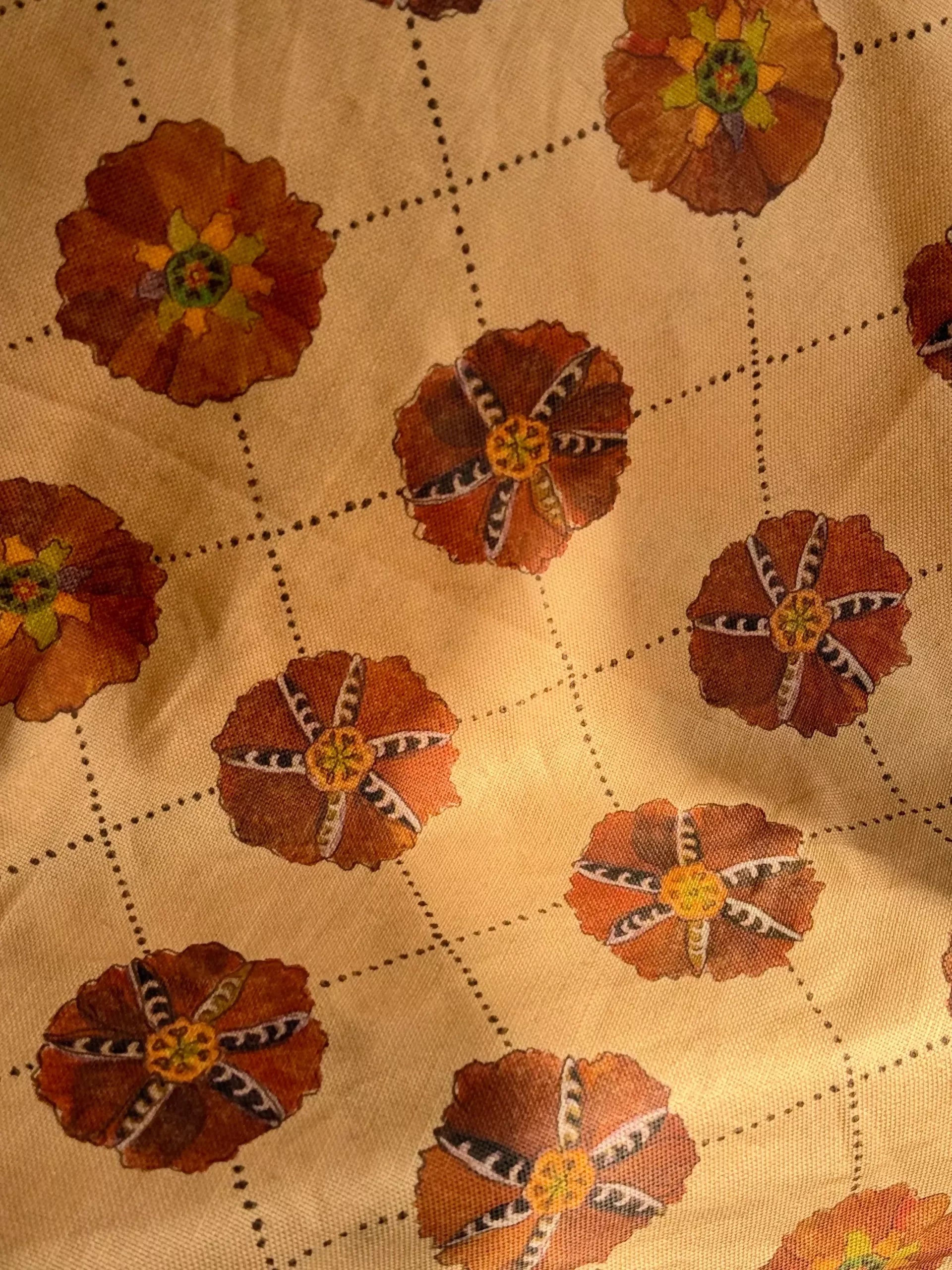 A piece of suzani fabric with floral patterns in beige, brown, and multicolor hues,  available  to buy on the-salon.com. SALON curates the finest , unique, handmade pieces from the interior industry's best makers and brands. Shop luxury furniture, lighting, rugs, art, antiques and vintage pieces and accessories from SALON interior designed rooms.