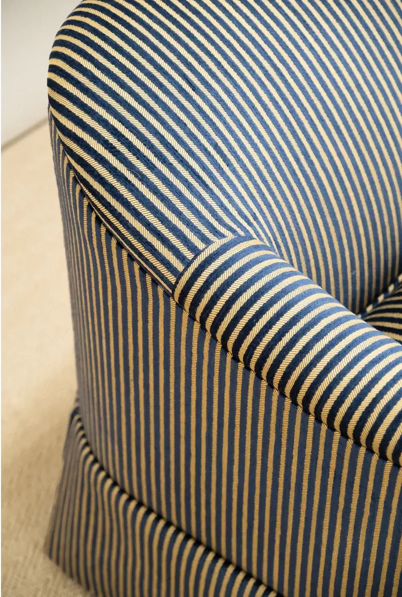 Close-up of a striped chair with blue and beige pattern