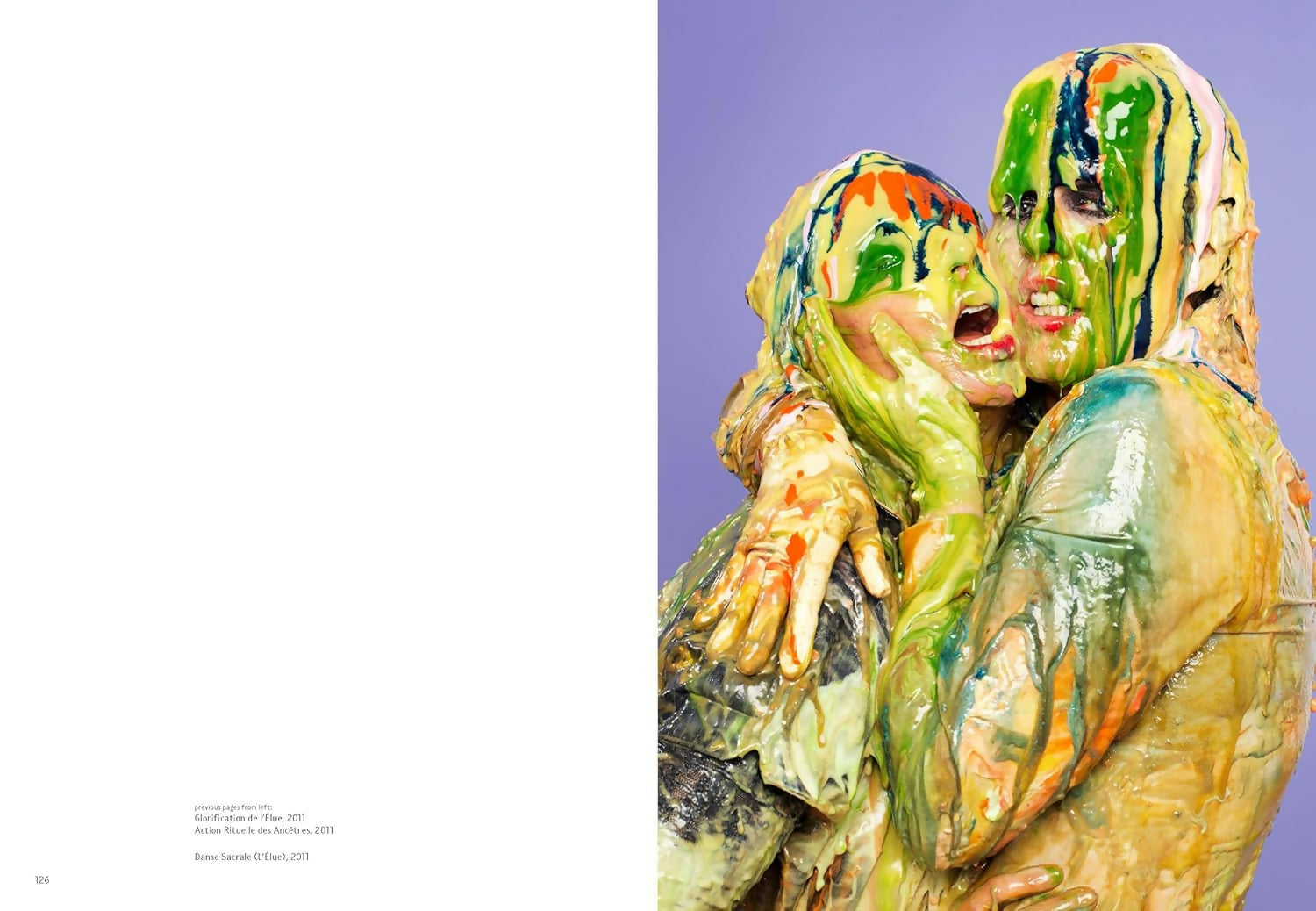 Two figures with colorful, smeared faces against a purple background,  available  to buy on the-salon.com. SALON curates the finest , unique, handmade pieces from the interior industry's best makers and brands. Shop luxury furniture, lighting, rugs, art, antiques and vintage pieces and accessories from SALON interior designed rooms.