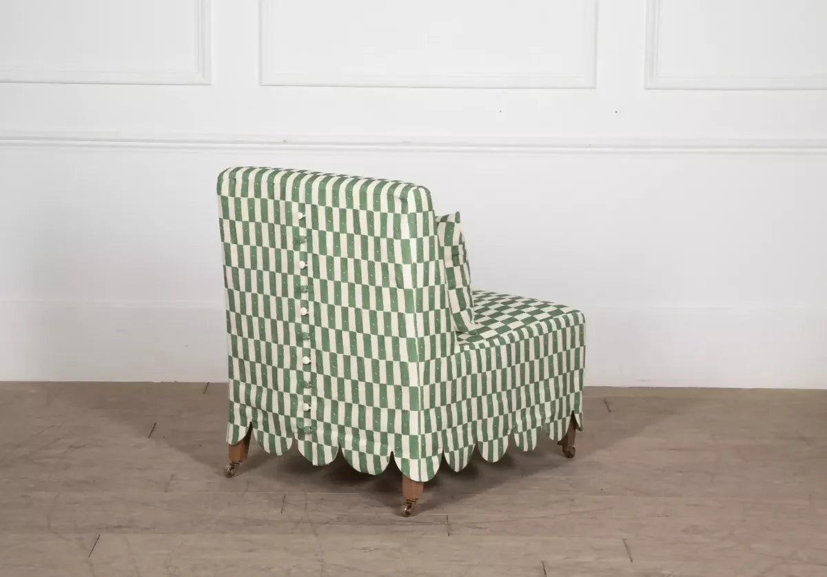 Green and white checkered chair on a wooden floor with a white wall background,  available  to buy on the-salon.com. SALON curates the finest , unique, handmade pieces from the interior industry's best makers and brands. Shop luxury furniture, lighting, rugs, art, antiques and vintage pieces and accessories from SALON interior designed rooms.
