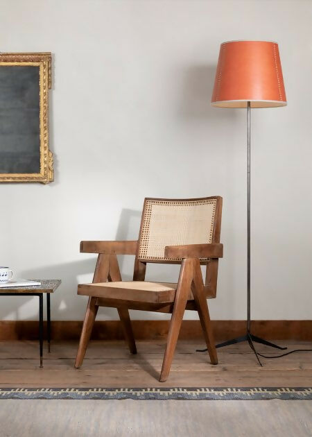 A tapered lampshade with a hand-stitched design, in Pompeian Buff colour, displayed on a stand against a neutral background, available  to buy on the-salon.com. SALON curates the finest , unique, handmade pieces from the interior industry's best makers and brands. Shop luxury furniture, lighting, rugs, art, antiques and vintage pieces and accessories from SALON interior designed rooms.