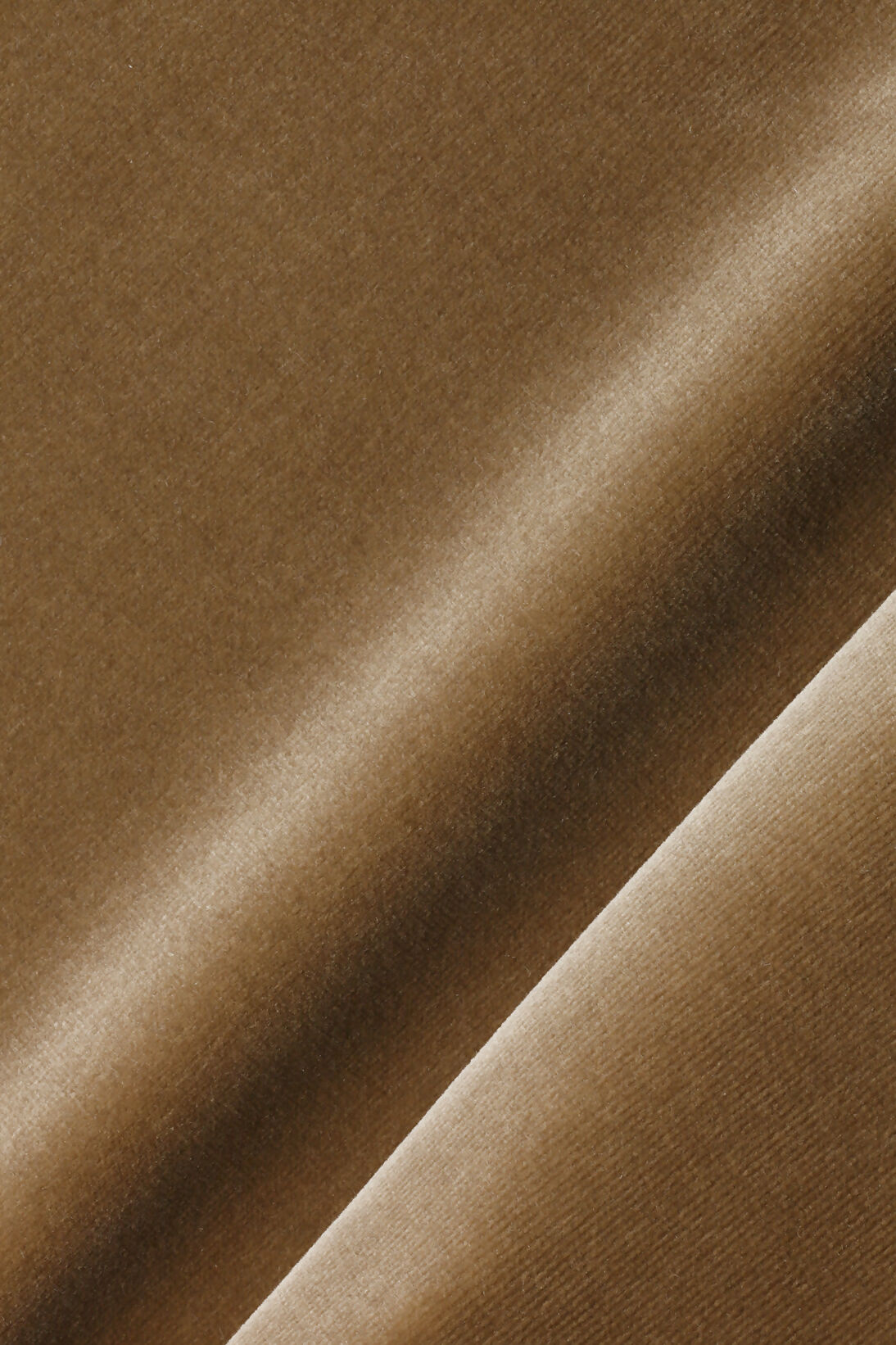 A close up on brown fabric, for the Cavendish armchair,  available  to buy on the-salon.com. SALON curates the finest , unique, handmade pieces from the interior industry's best makers and brands. Shop luxury furniture, lighting, rugs, art, antiques and vintage pieces and accessories from SALON interior designed rooms.