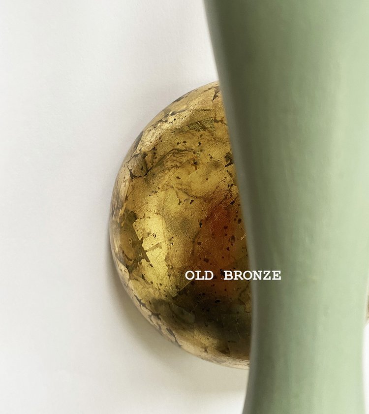 A wall-mounted light fixture with a green painted stem and a white conical lampshade, with a old-bronze wall plate, available  to buy on the-salon.com. SALON curates the finest , unique, handmade pieces from the interior industry's best makers and brands. Shop luxury furniture, lighting, rugs, art, antiques and vintage pieces and accessories from SALON interior designed rooms.